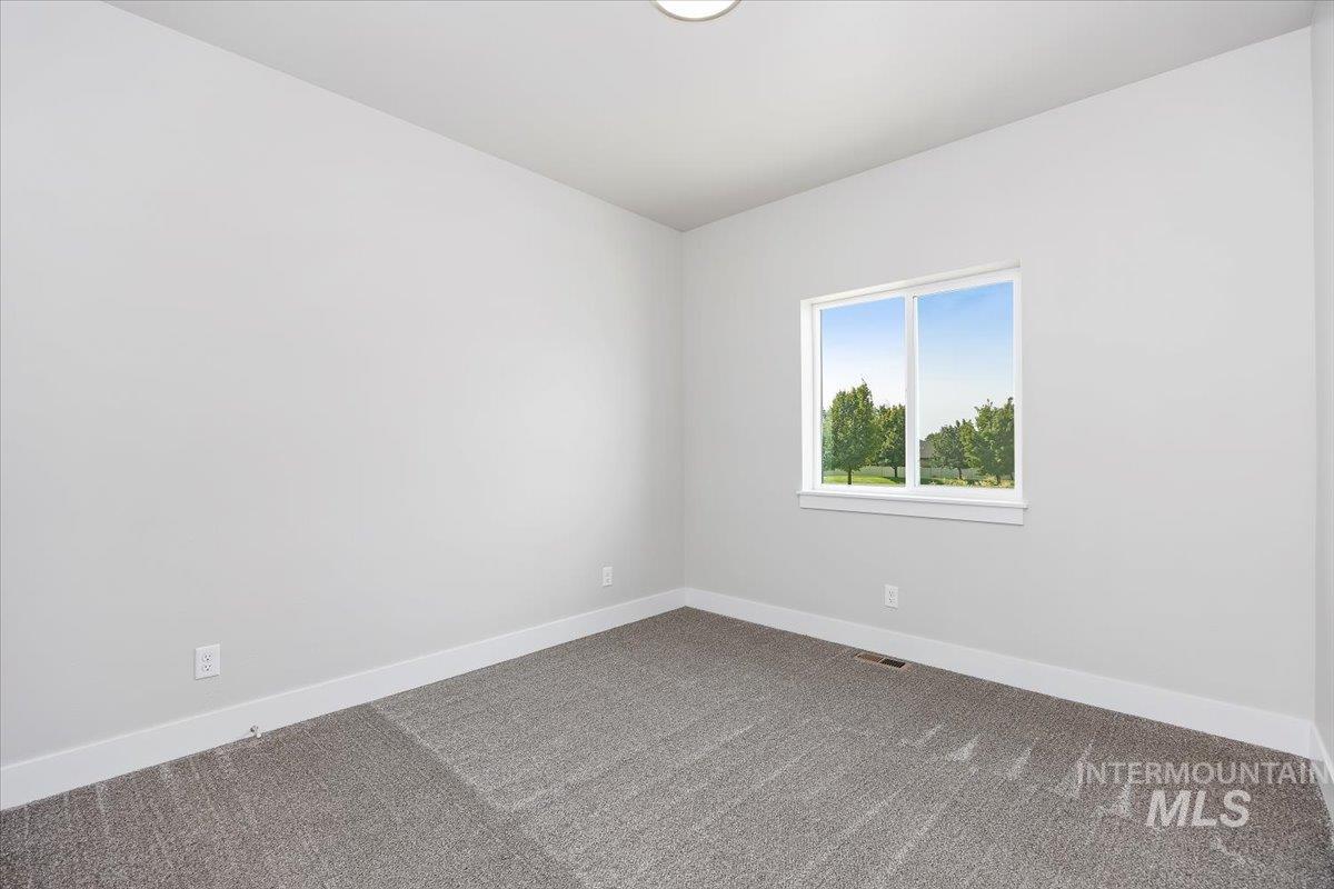 Unfurnished room featuring carpet