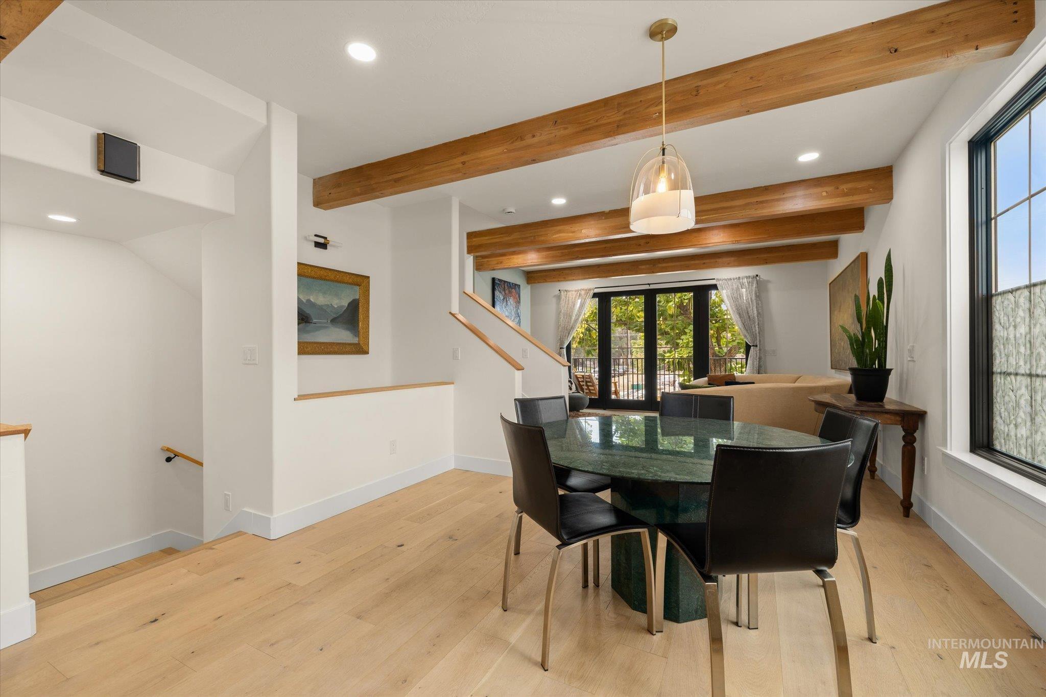 Dining room featuring recessed lighting, beamed ceiling, and light wood-type flooring