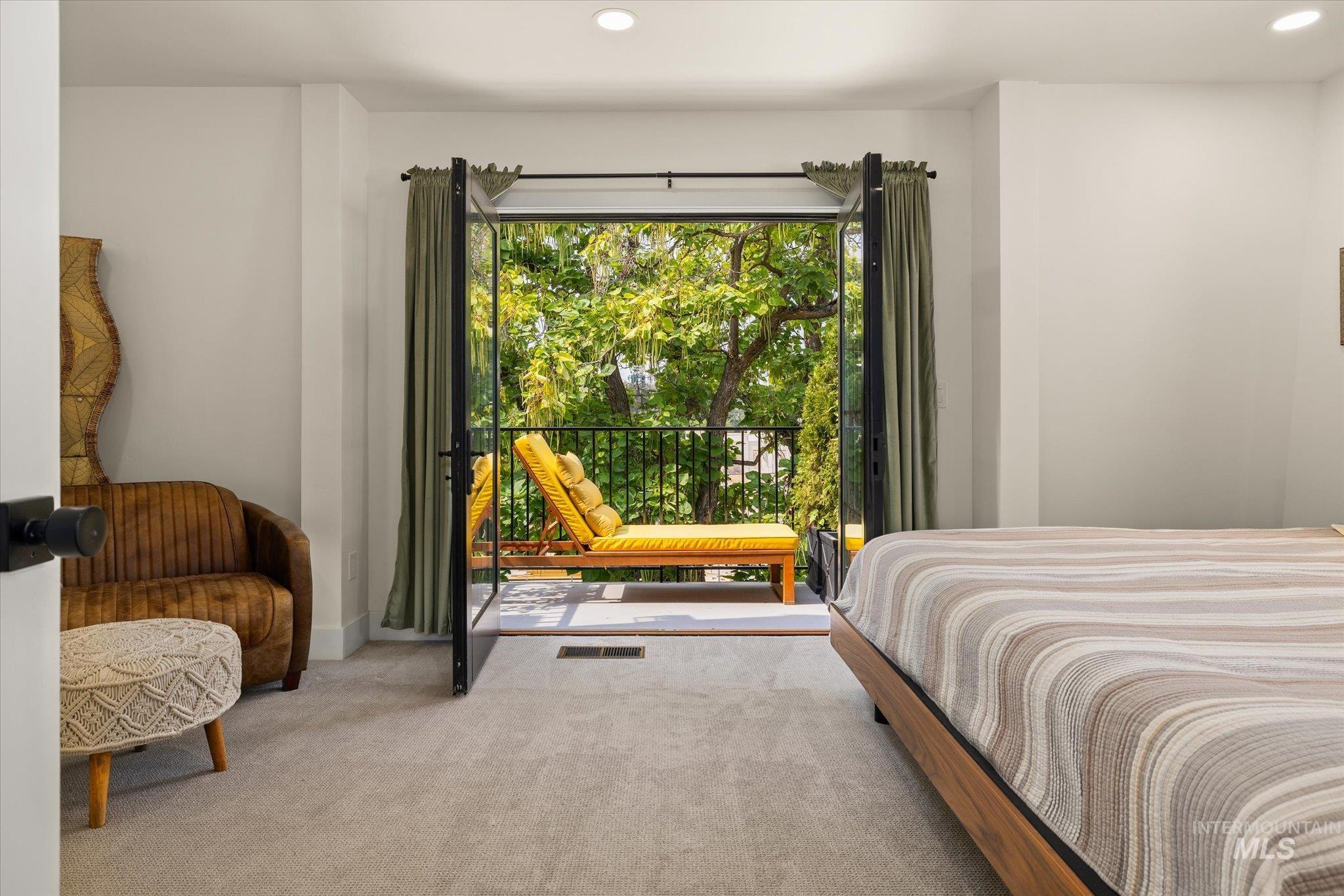 Carpeted bedroom with recessed lighting