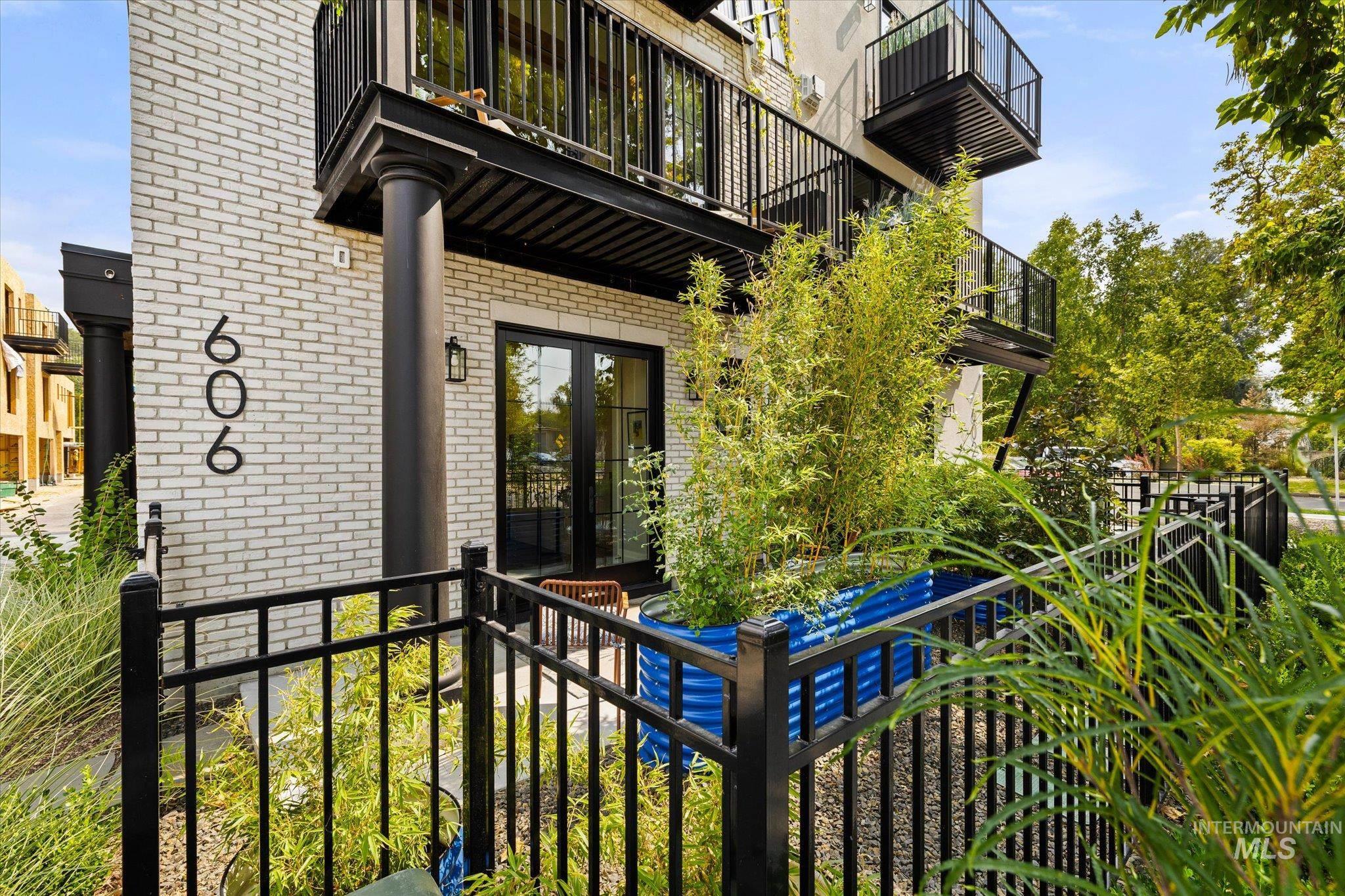 View of exterior entry featuring brick siding