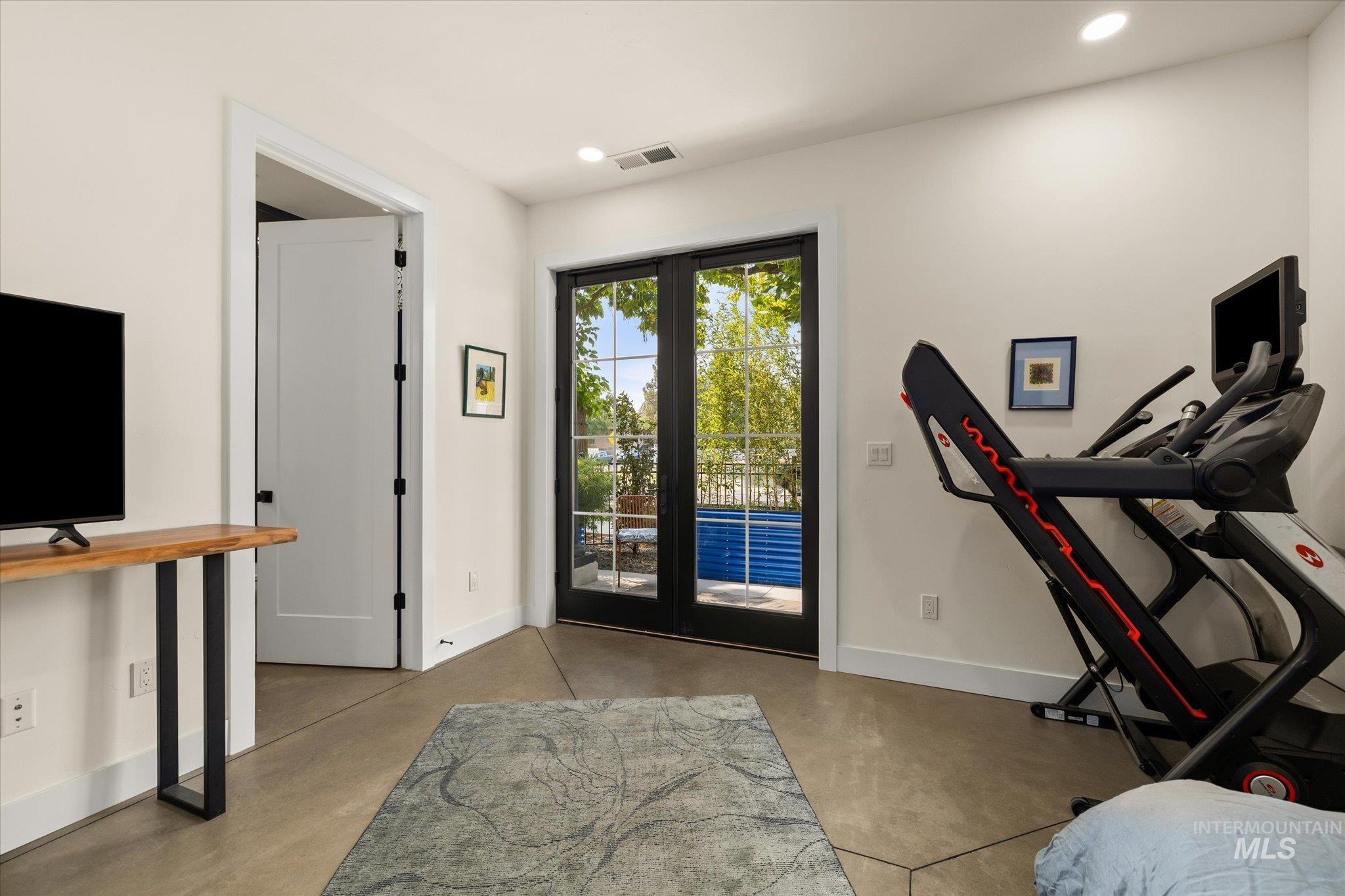 Entrance foyer featuring concrete floors and recessed lighting