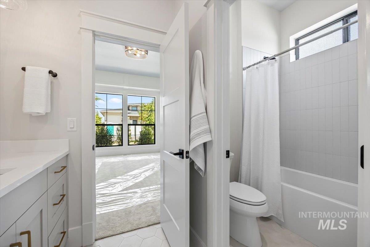 Bathroom with vanity and shower / bath combo