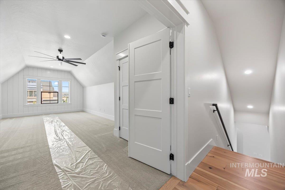 Bonus room featuring vaulted ceiling, recessed lighting, ceiling fan, and light colored carpet