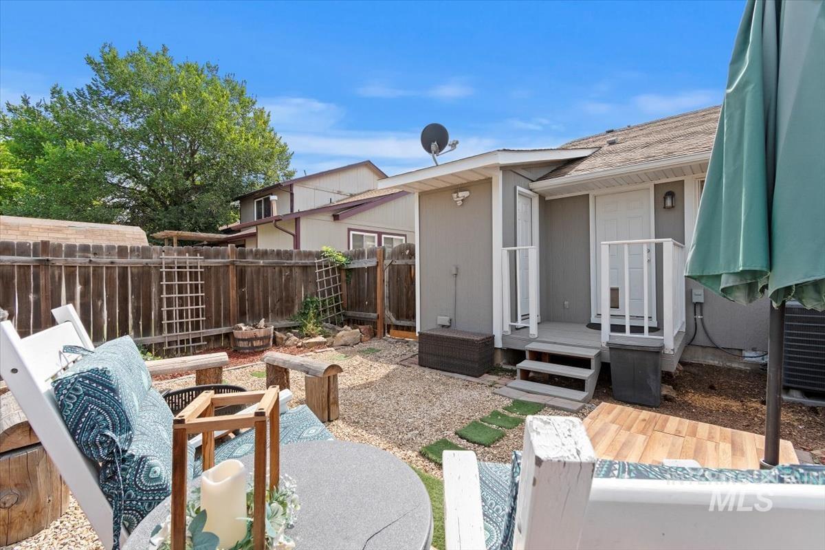 Fenced backyard featuring a deck and a patio area