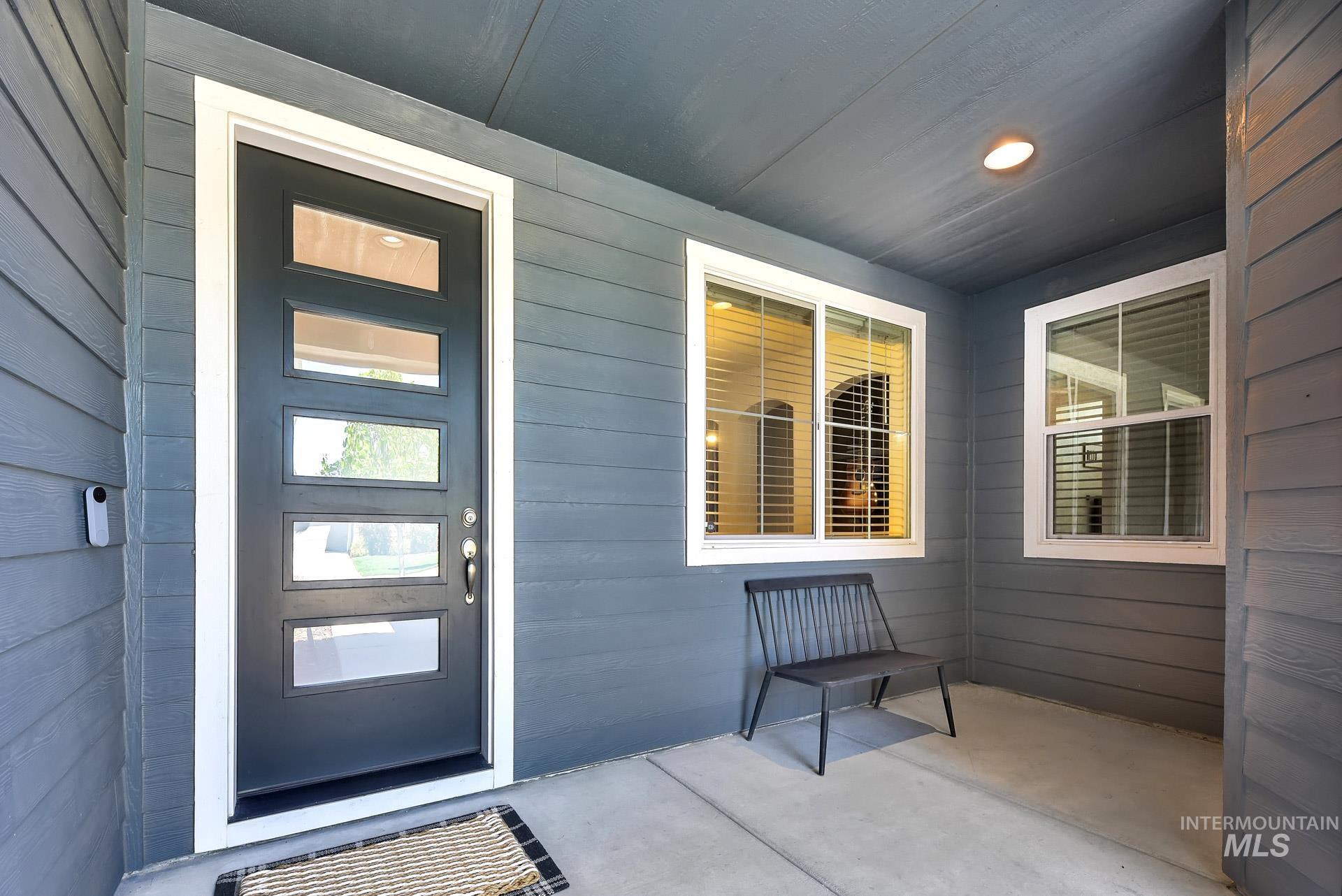 Doorway to property featuring a patio