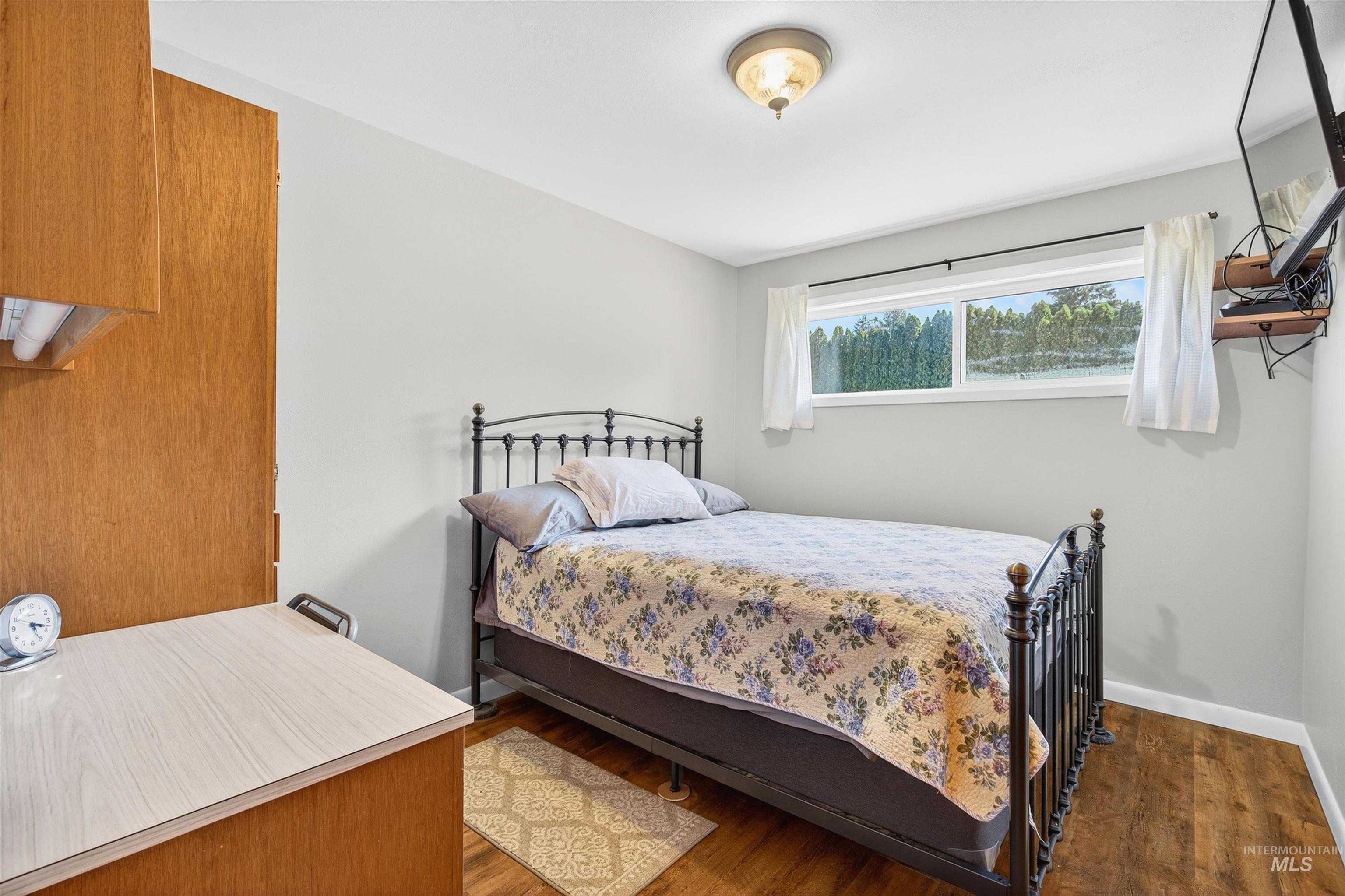 Bedroom with wood finished floors