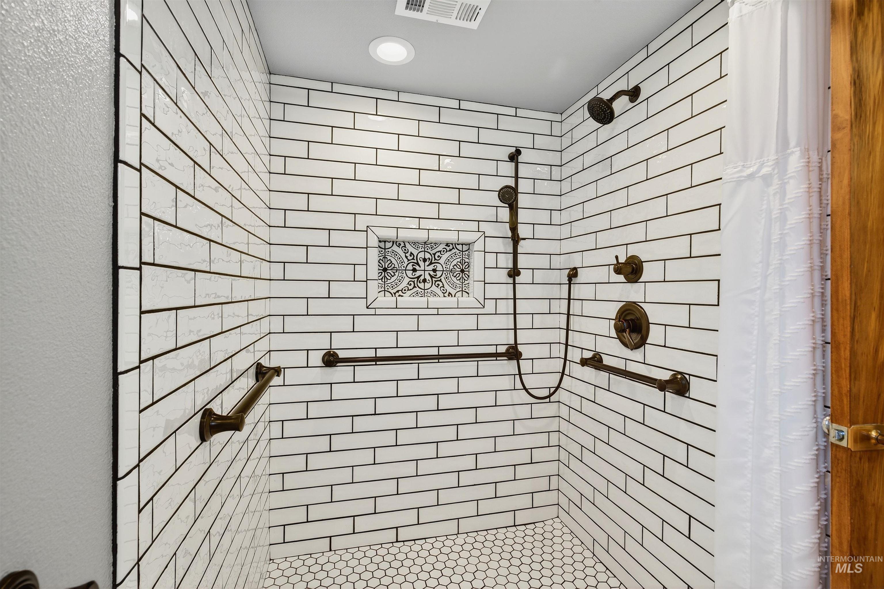 Full bathroom with a stall shower and recessed lighting
