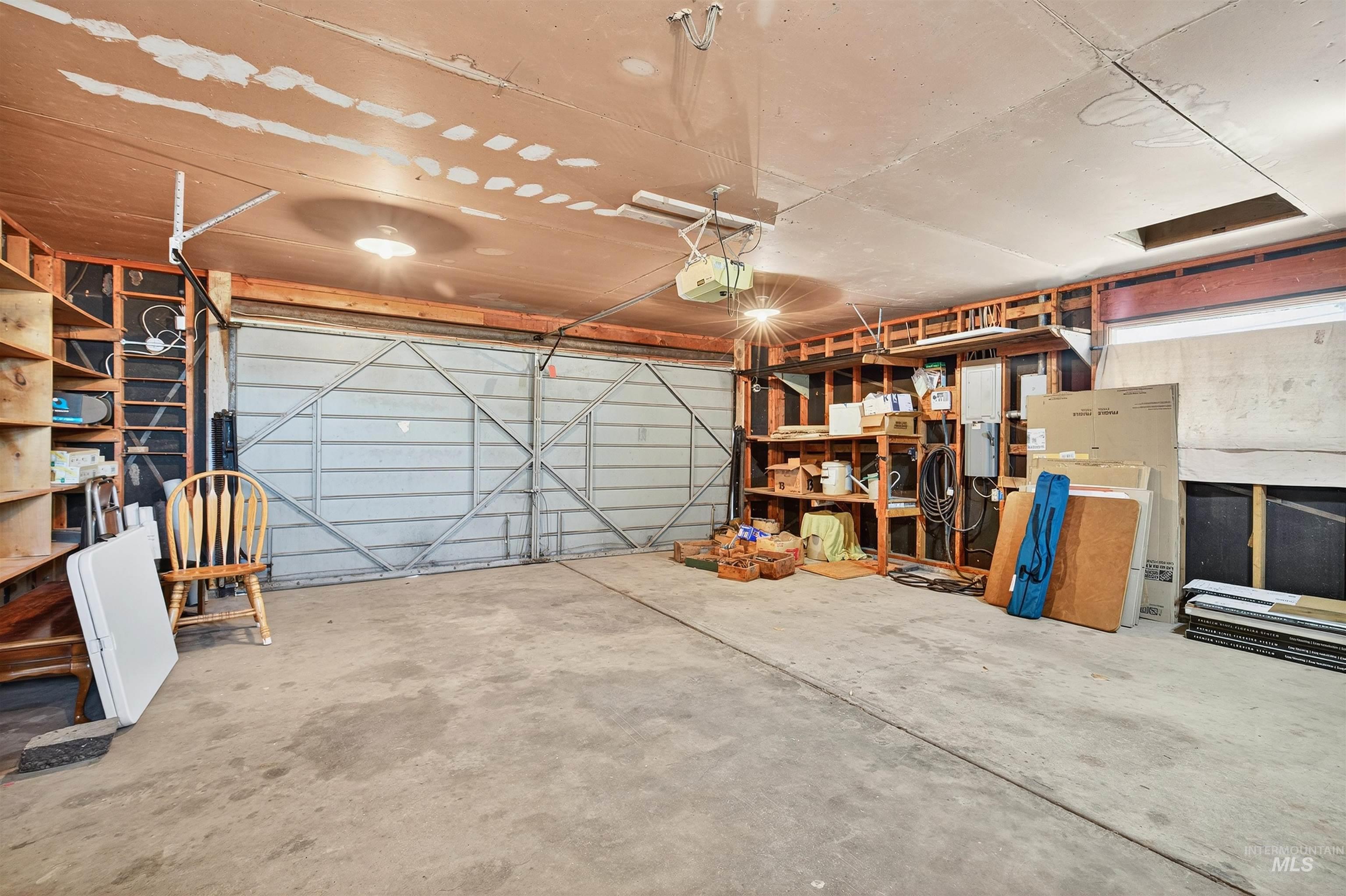 Garage featuring a garage door opener