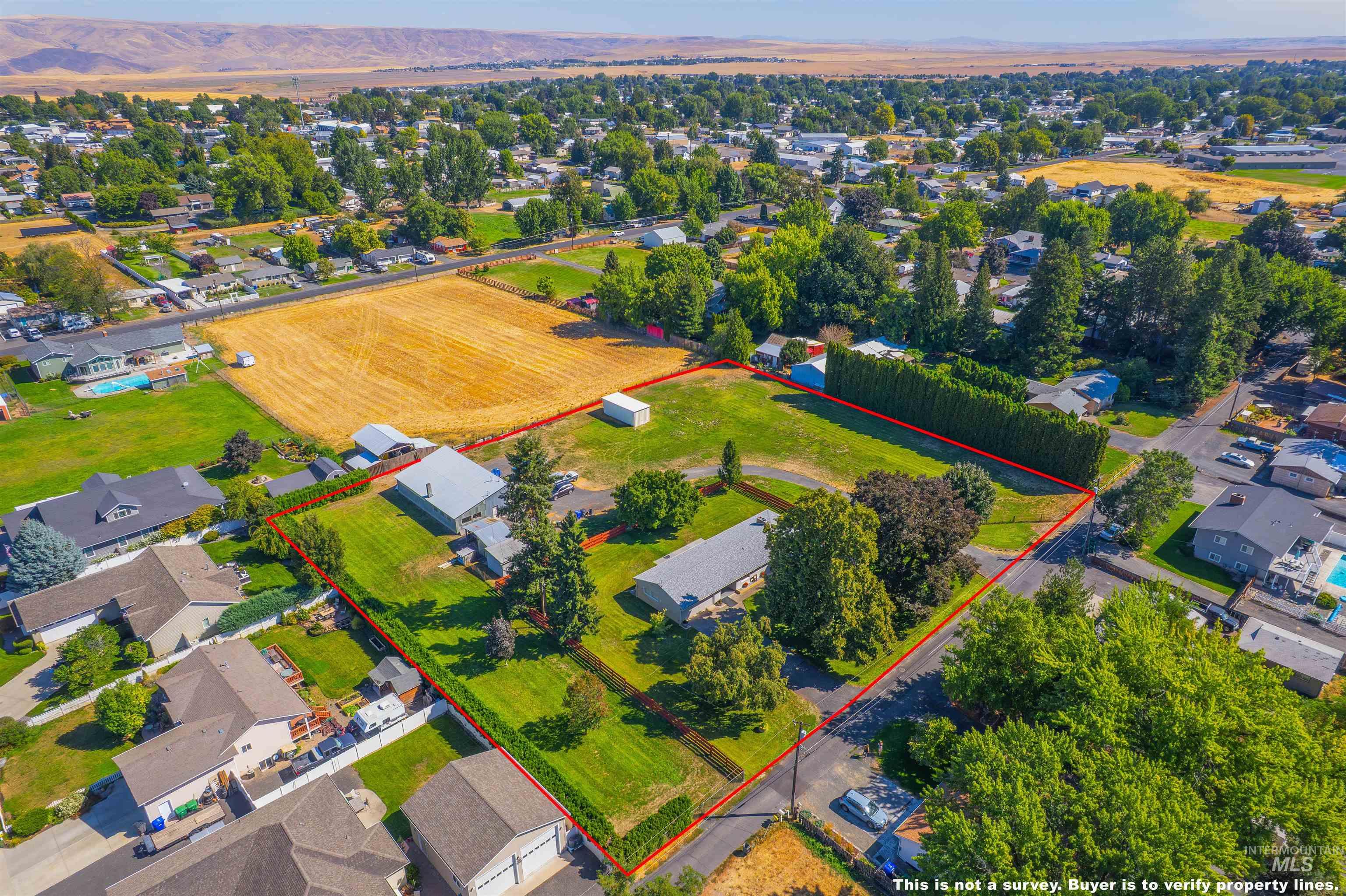 Aerial perspective of suburban area with property boundaries highlighted