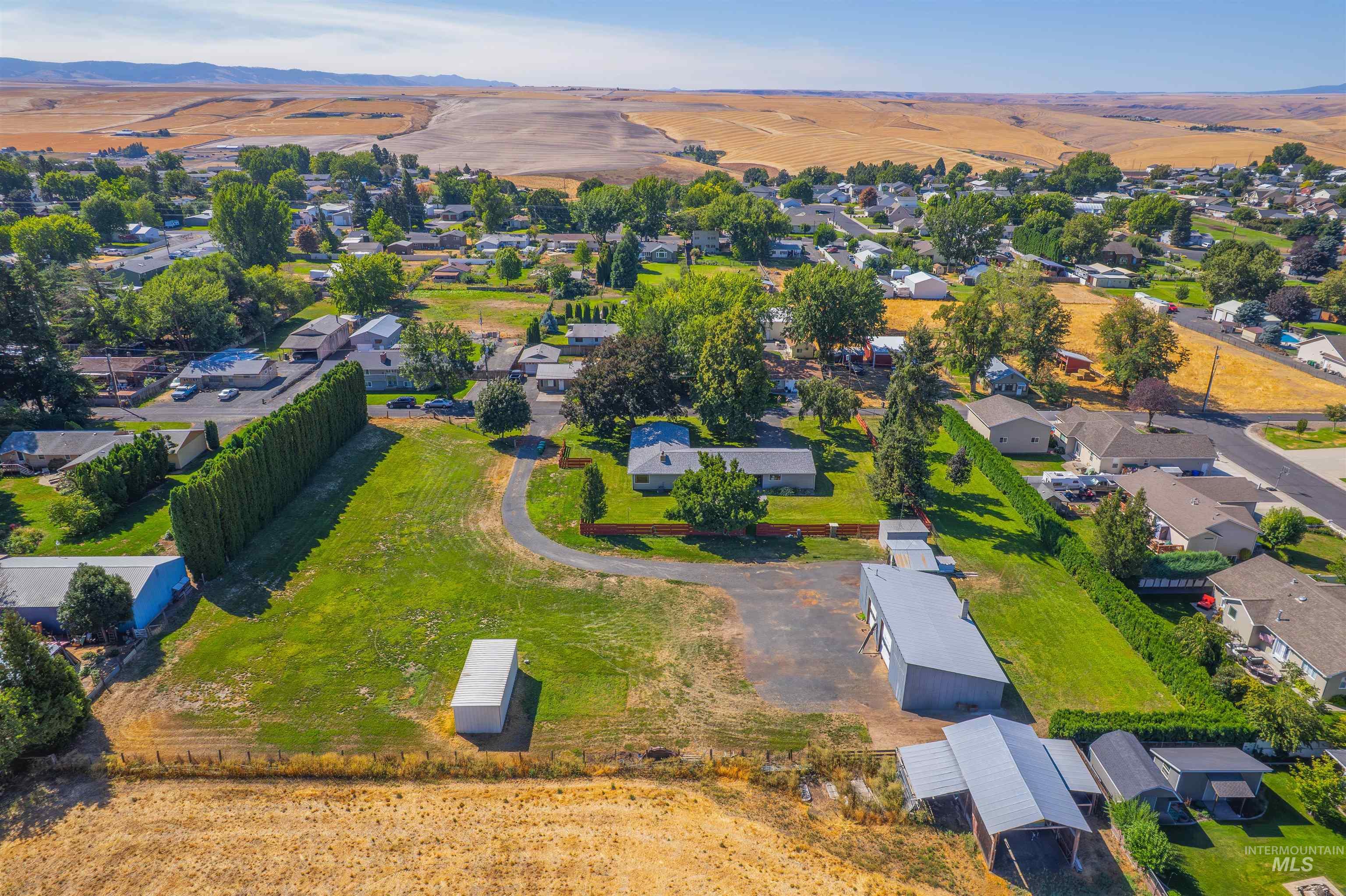 Aerial overview of property's location featuring nearby suburban area