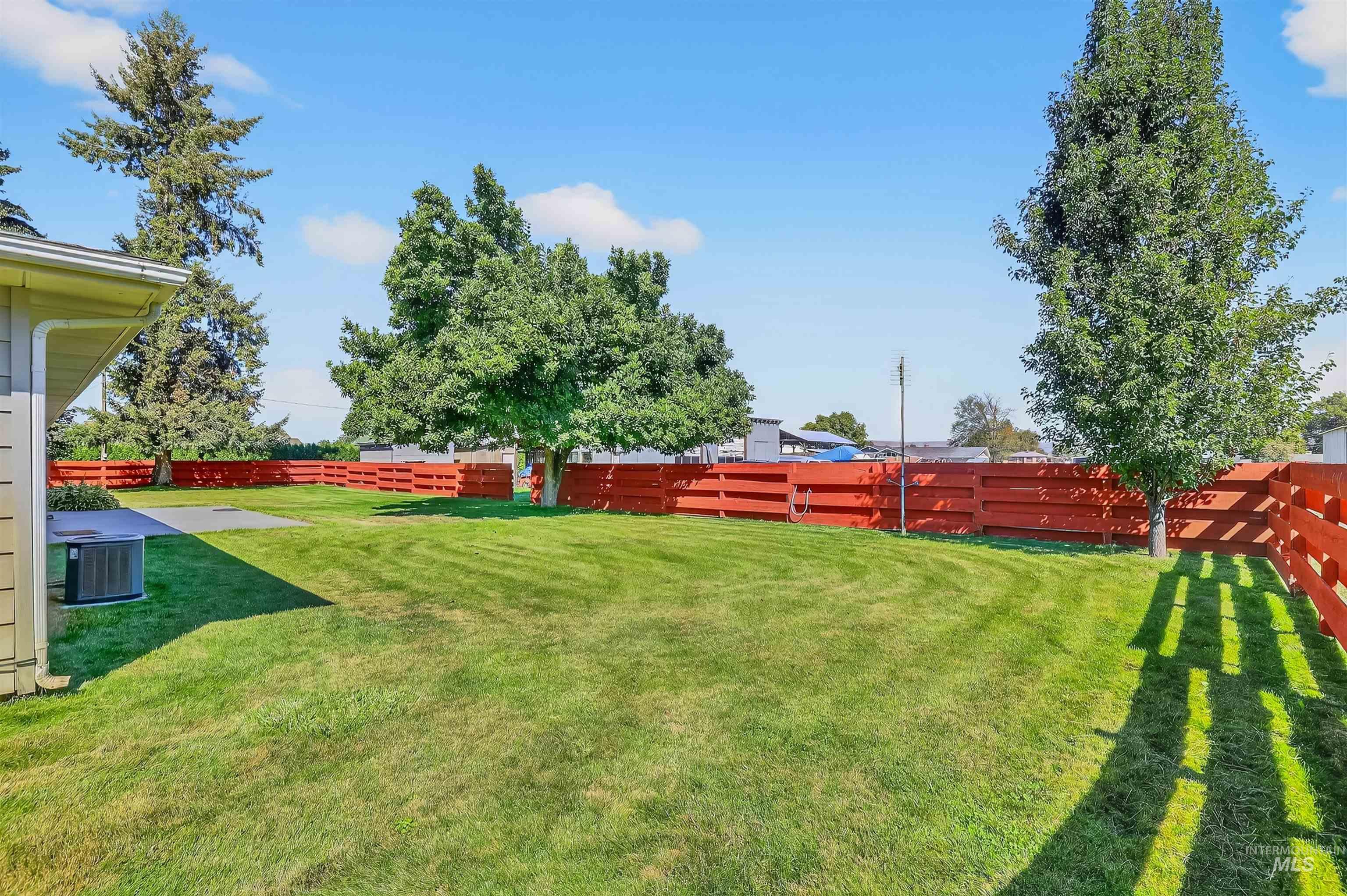 View of fenced backyard