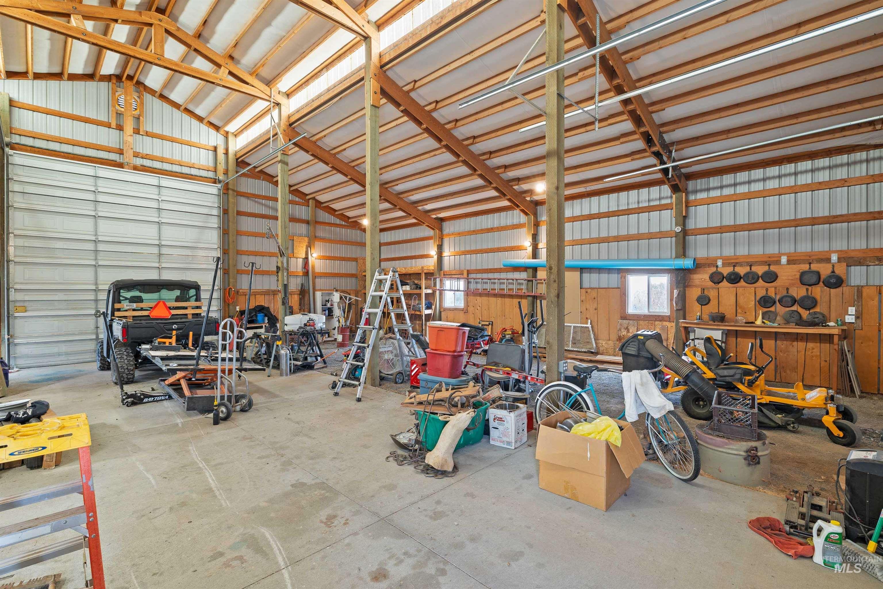 Garage with metal wall and a workshop area