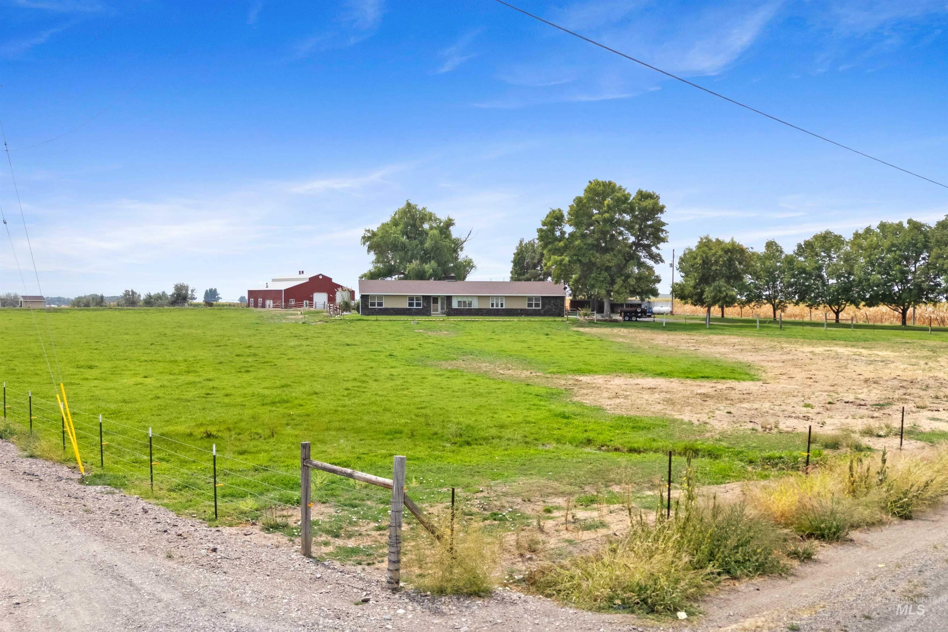 View of yard with a rural view