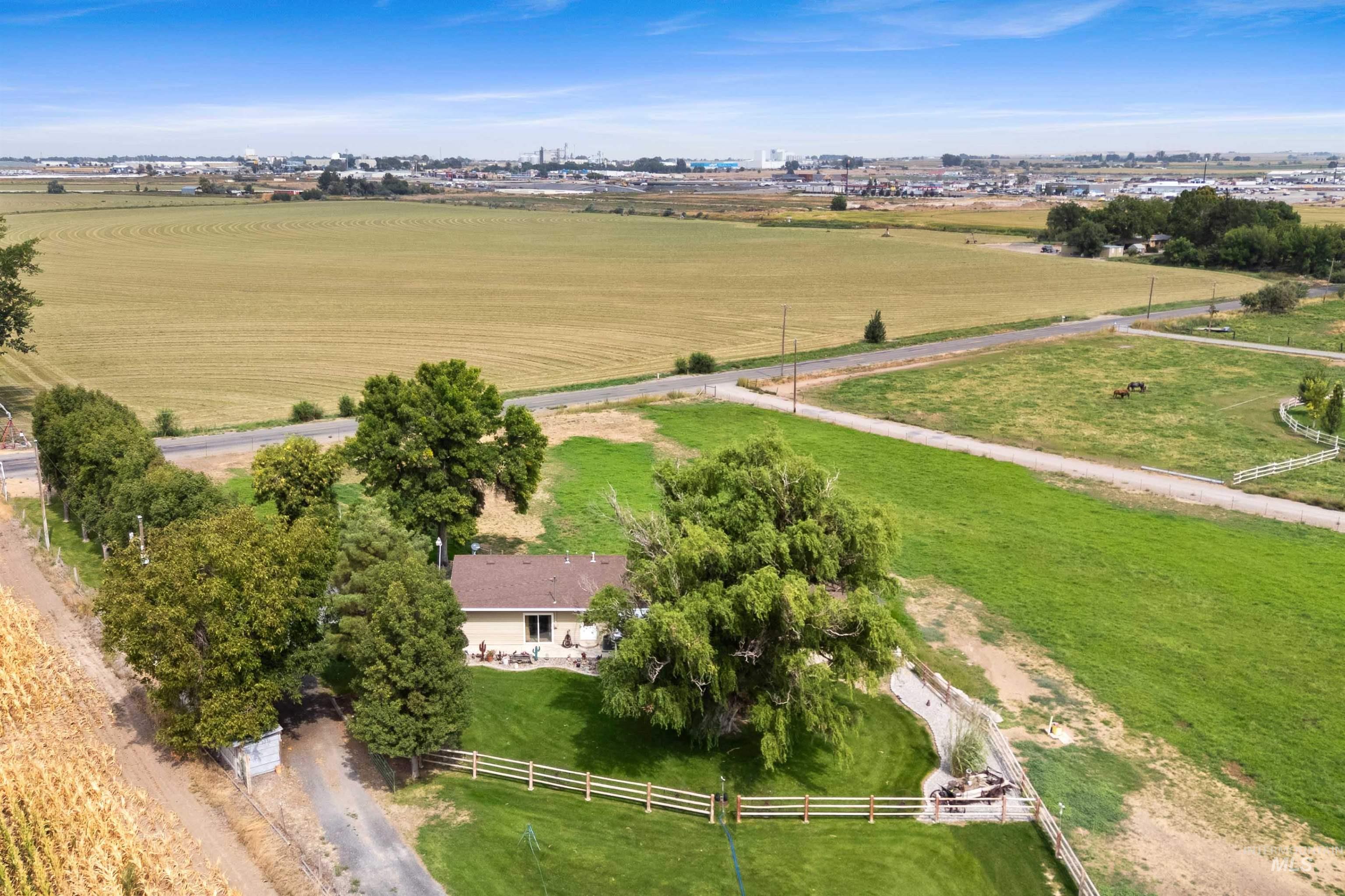 Aerial view of property's location featuring rural landscape and agricultural land
