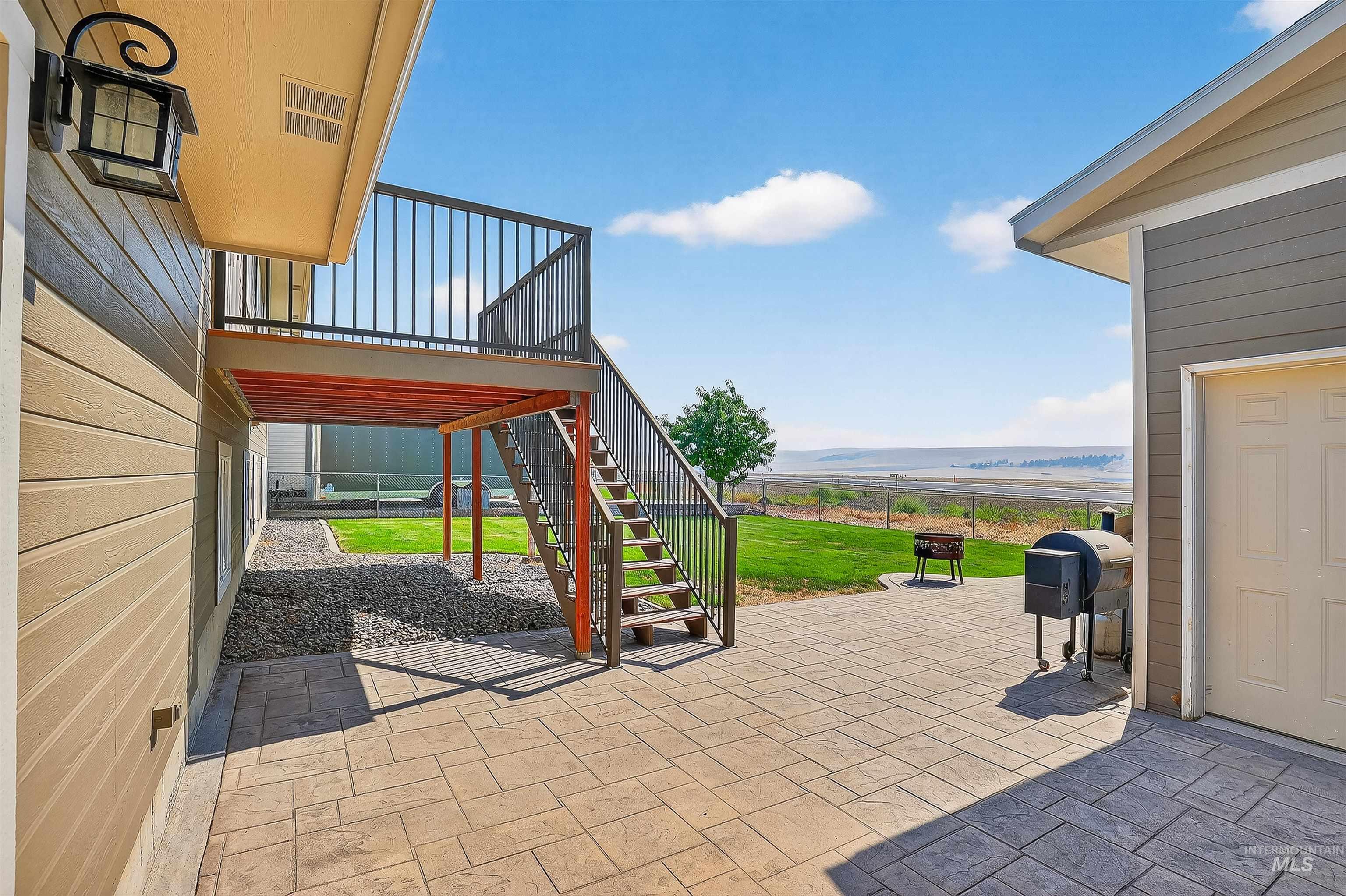 View of patio / terrace with a grill and stairway