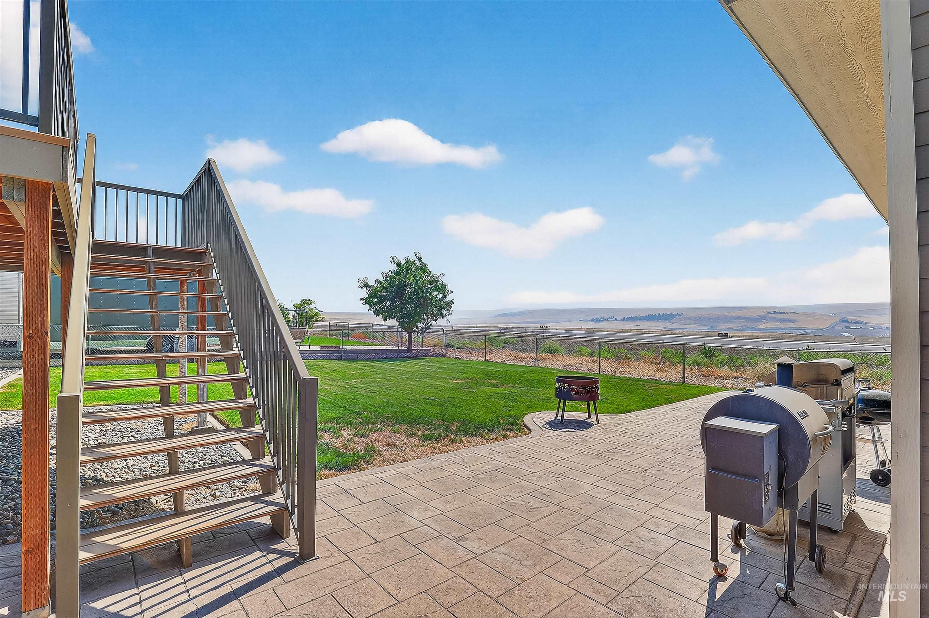 View of patio / terrace with stairway and a grill