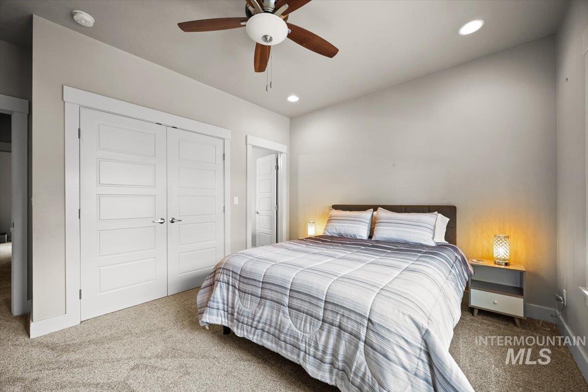 Bedroom featuring carpet flooring, a closet, ceiling fan, and recessed lighting
