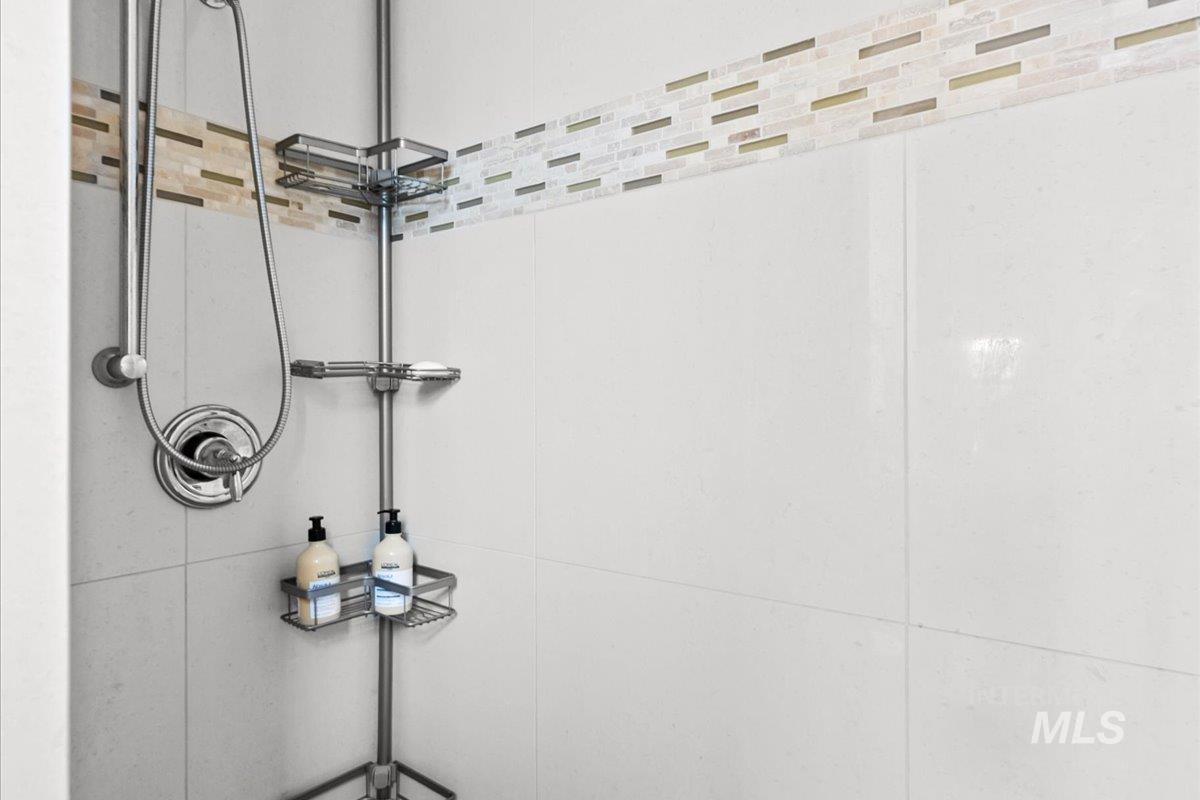 Bathroom view of a tile shower