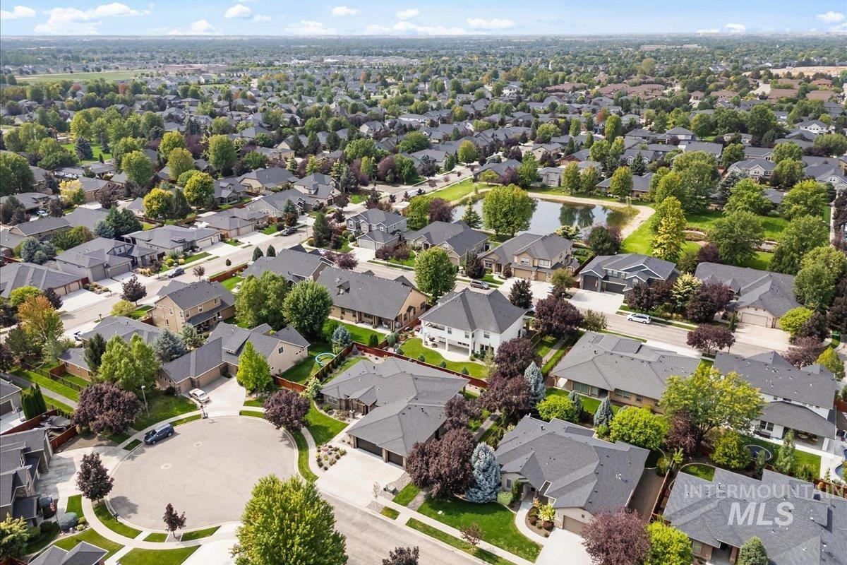 Aerial perspective of suburban area with a large body of water