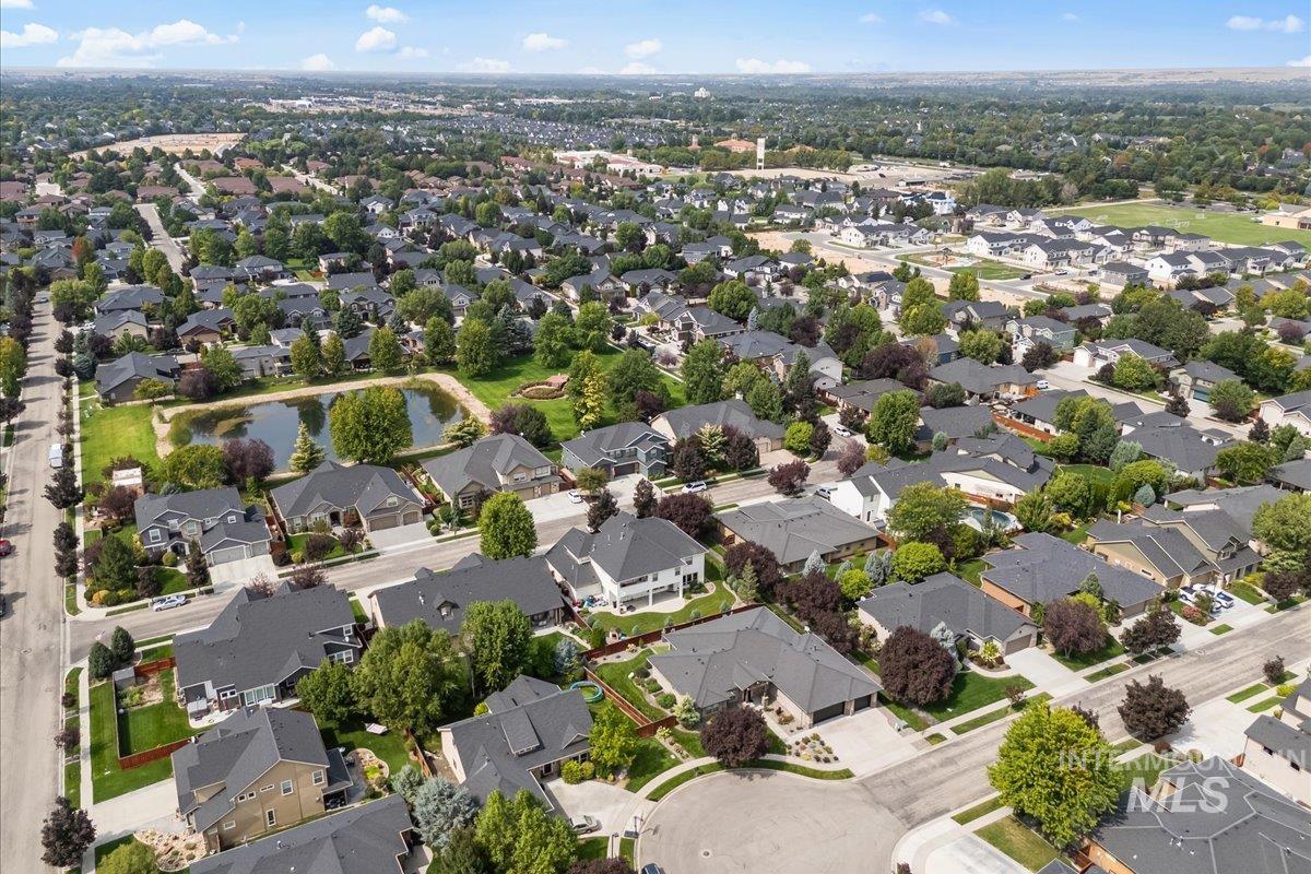 View of property location featuring a nearby body of water and nearby suburban area