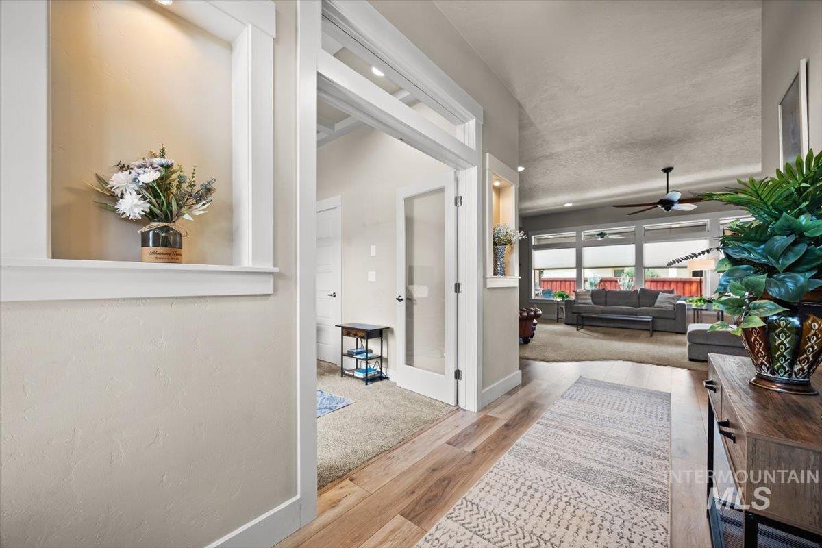 Hall featuring baseboards and light wood-style flooring