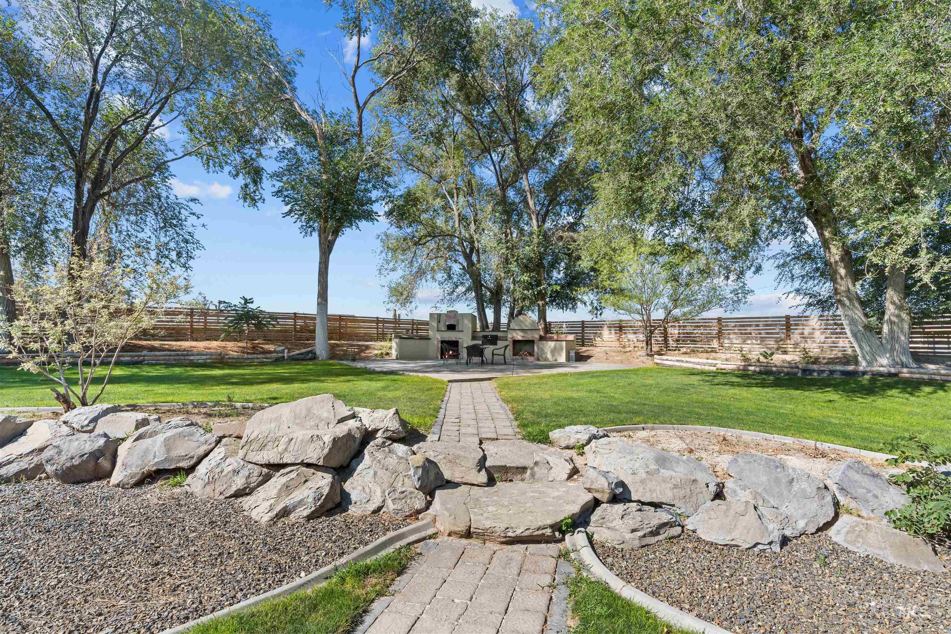 Fenced backyard with a patio area