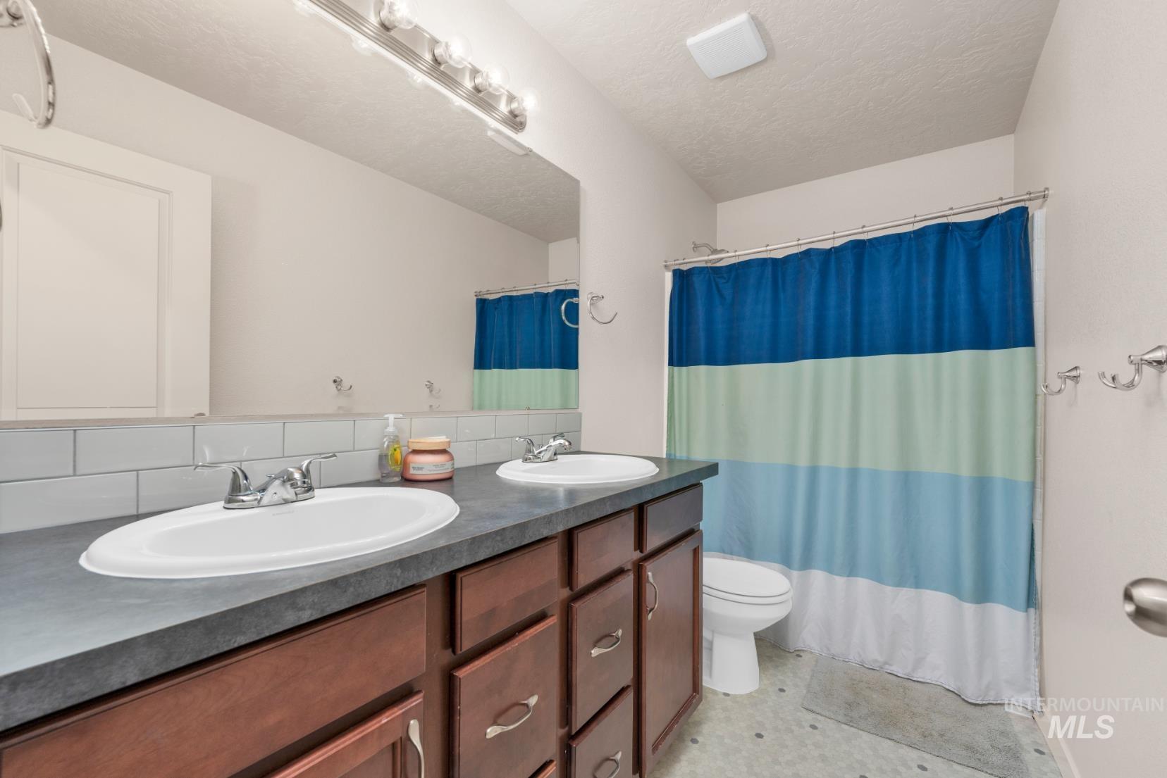 Full bathroom with double vanity