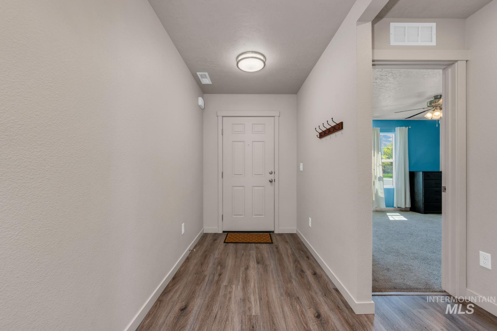 Entryway featuring plank style wood finished floors