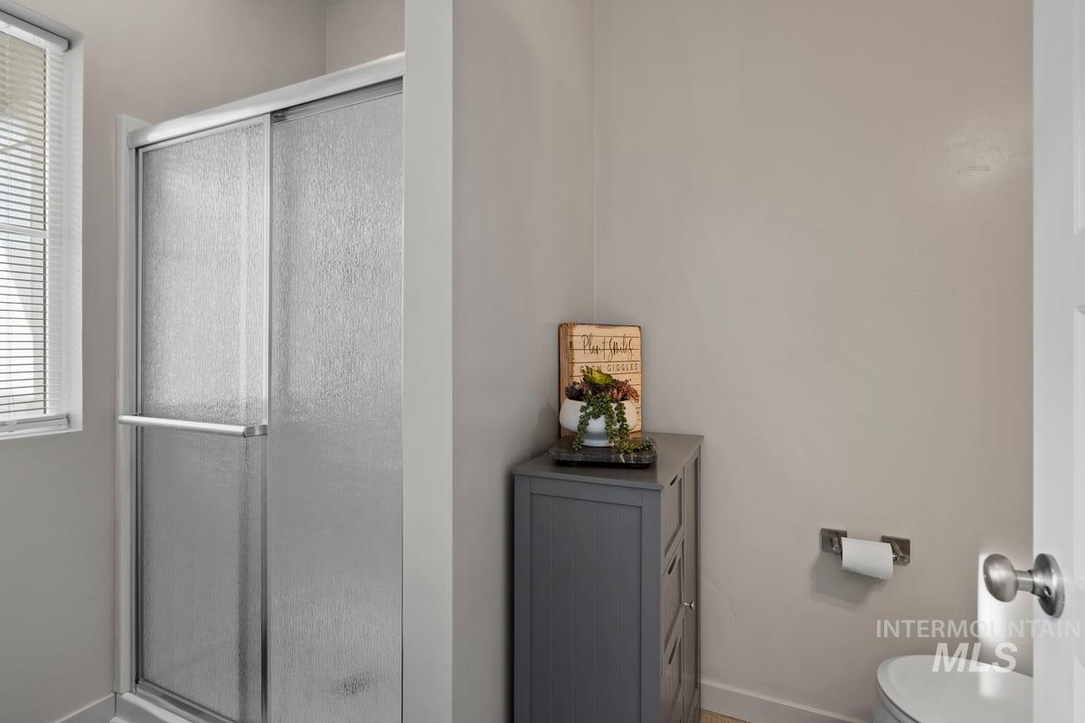 Full bath with a shower stall