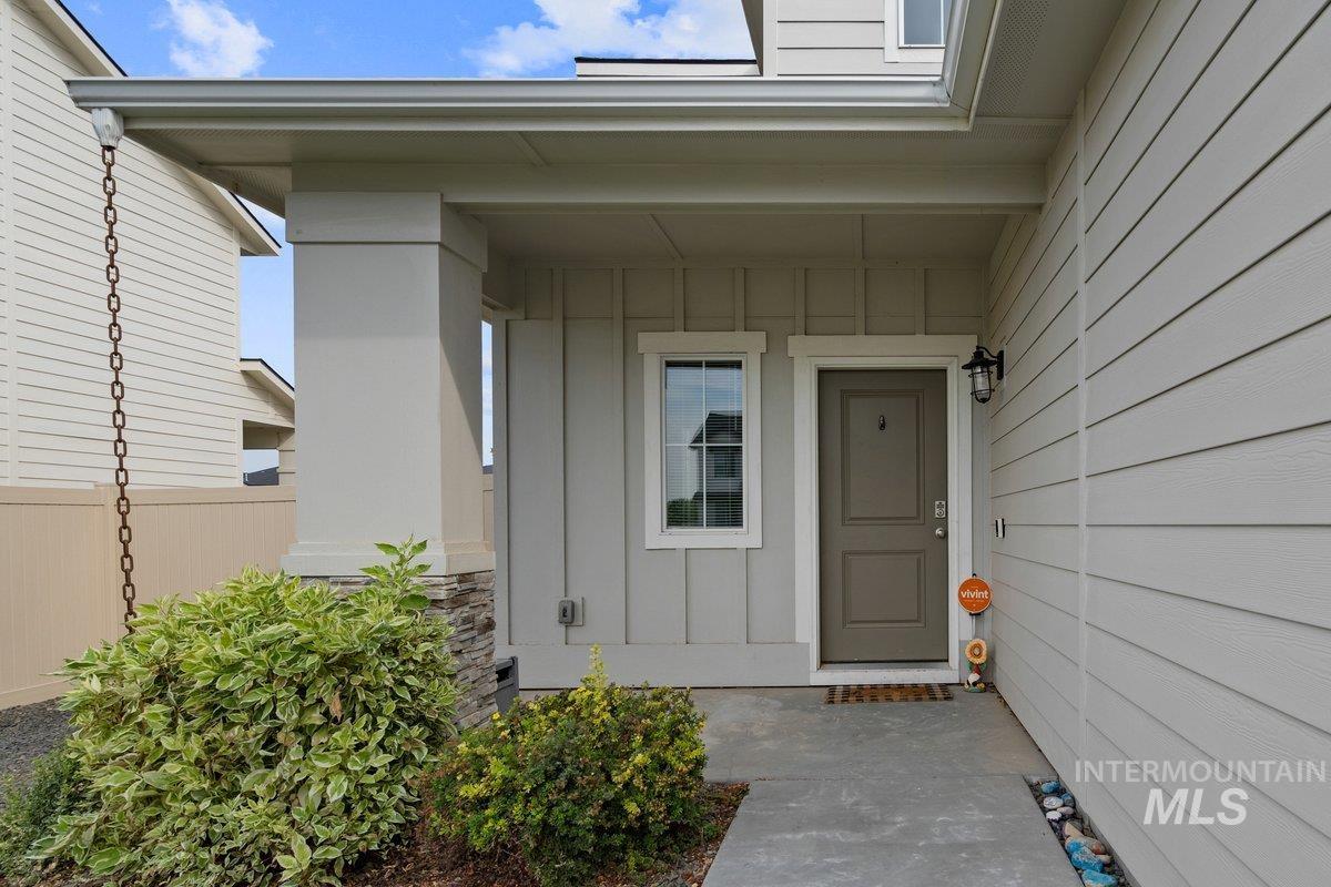 Entrance to property with board and batten siding