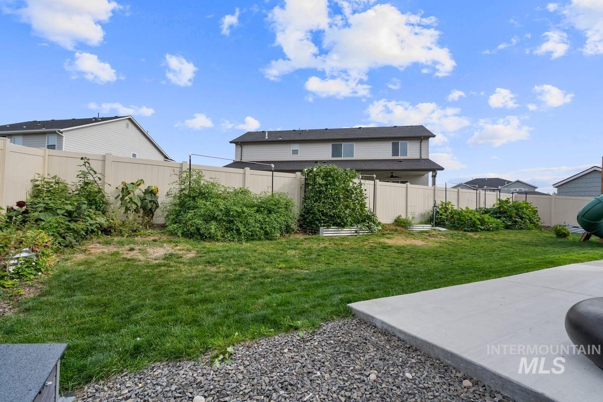 View of fenced backyard