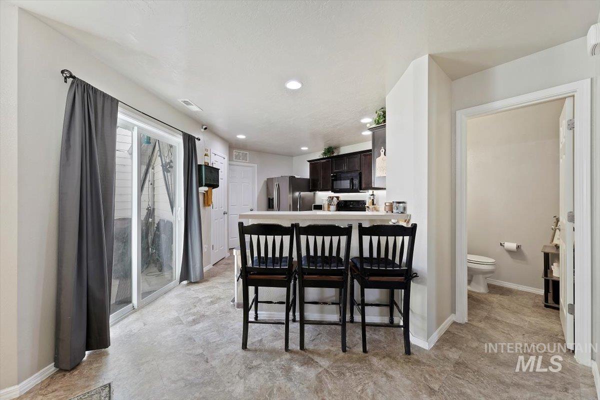 Dining space featuring baseboards and recessed lighting