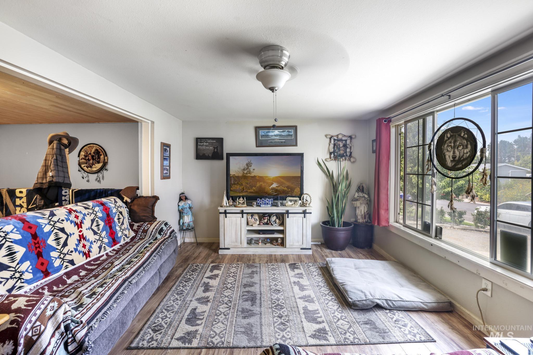 Living area featuring wood finished floors and baseboards