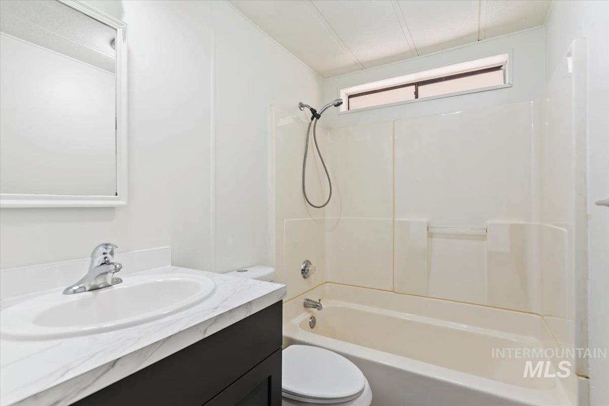 Full bath with shower / tub combination and vanity