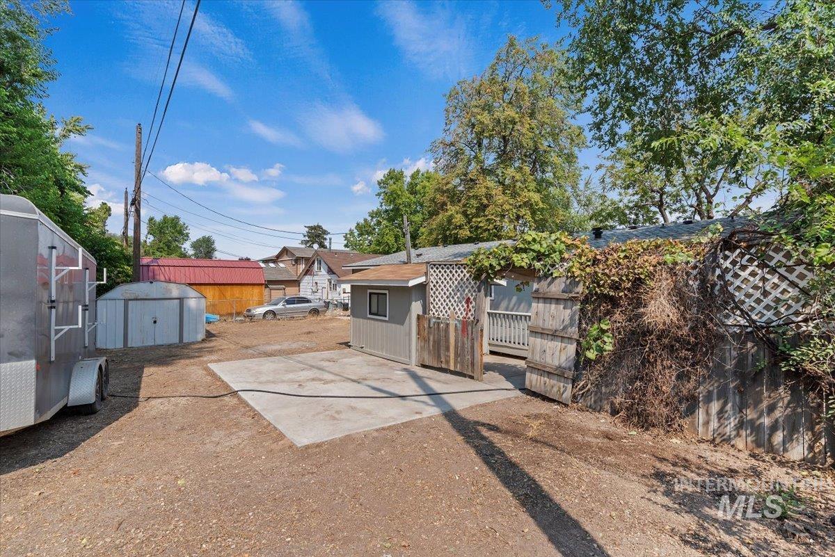 View of yard featuring a storage unit