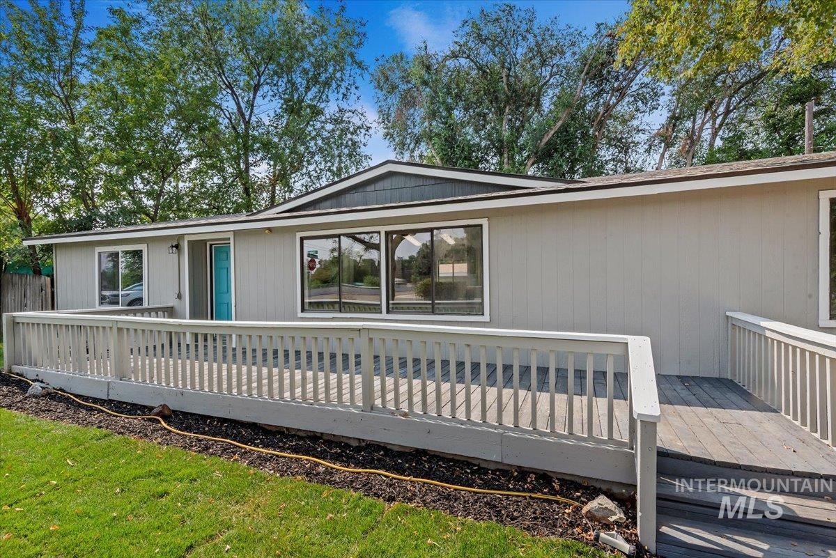 View of front of property featuring a deck