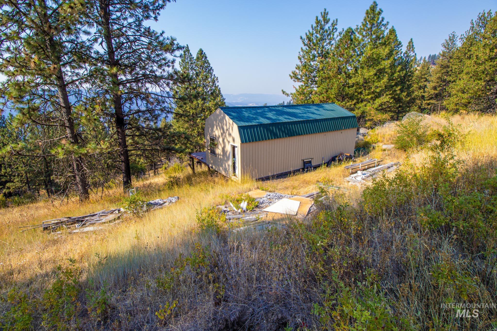 View of yard with an outdoor structure and an outbuilding