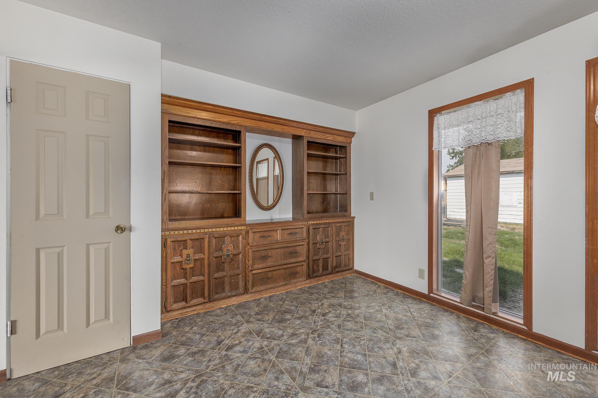 Interior space featuring baseboards and built in features