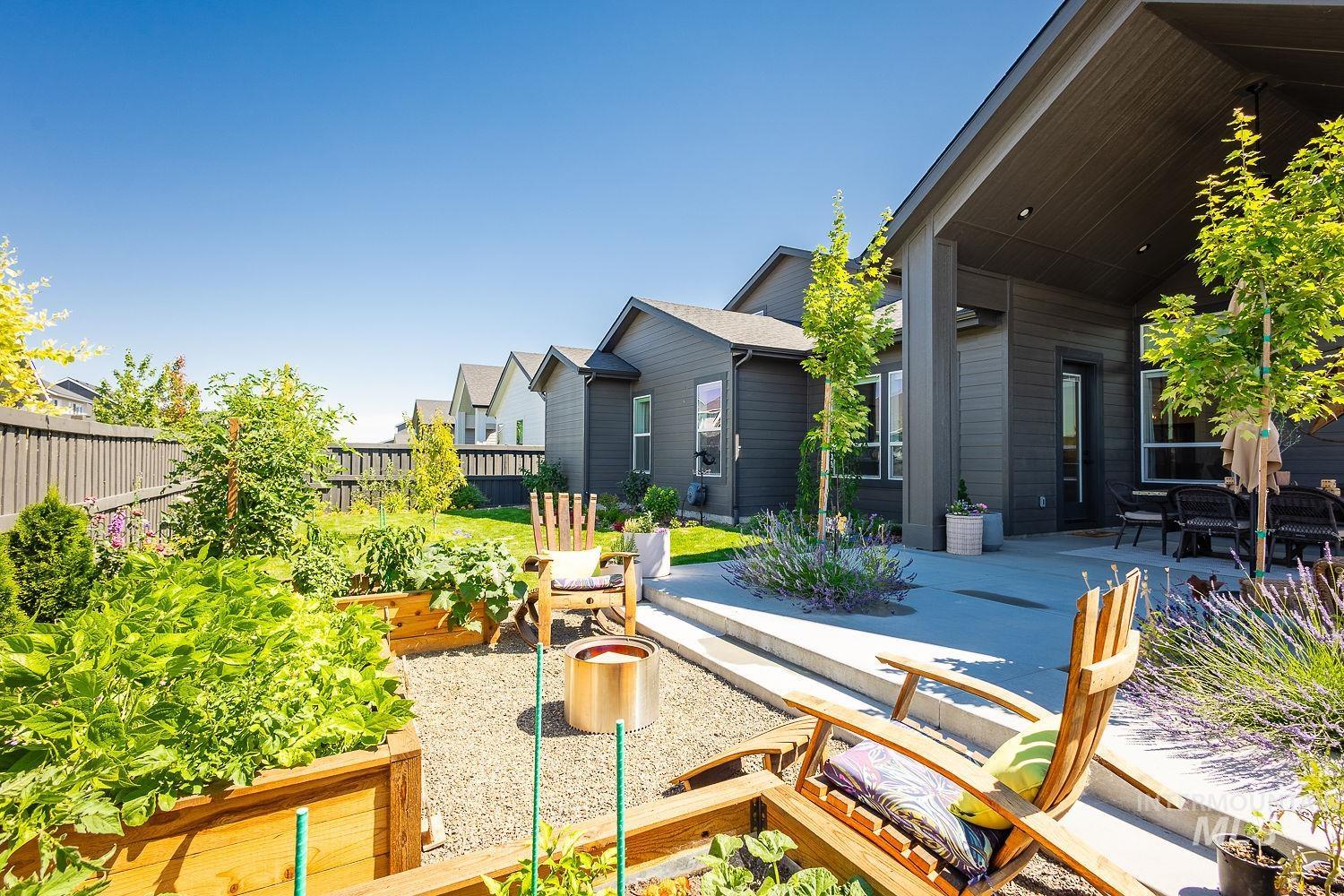 View of yard with a patio and a garden