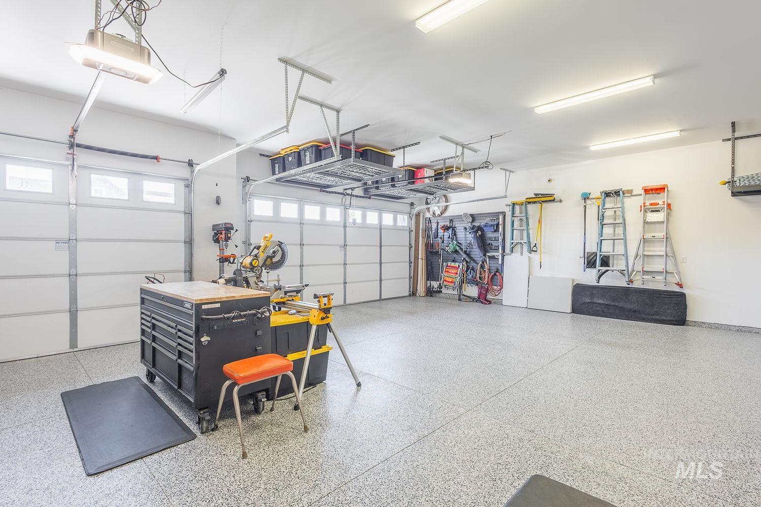 Garage featuring a garage door opener