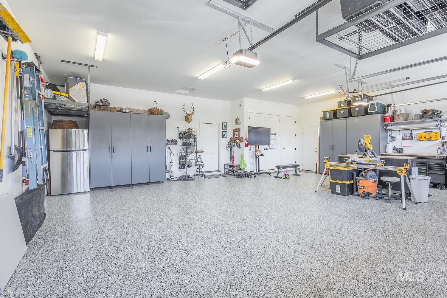 Garage featuring a garage door opener