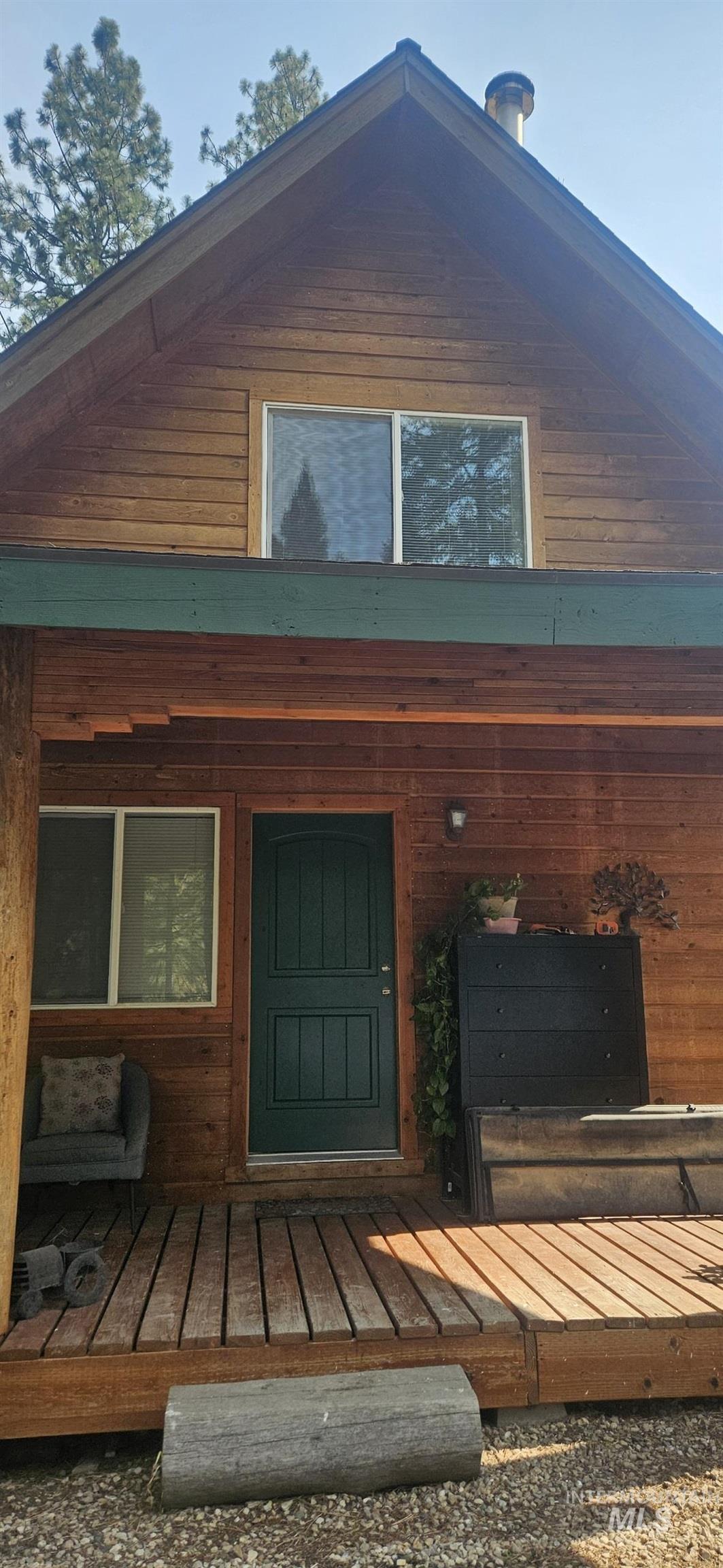 Doorway to property with a wooden deck