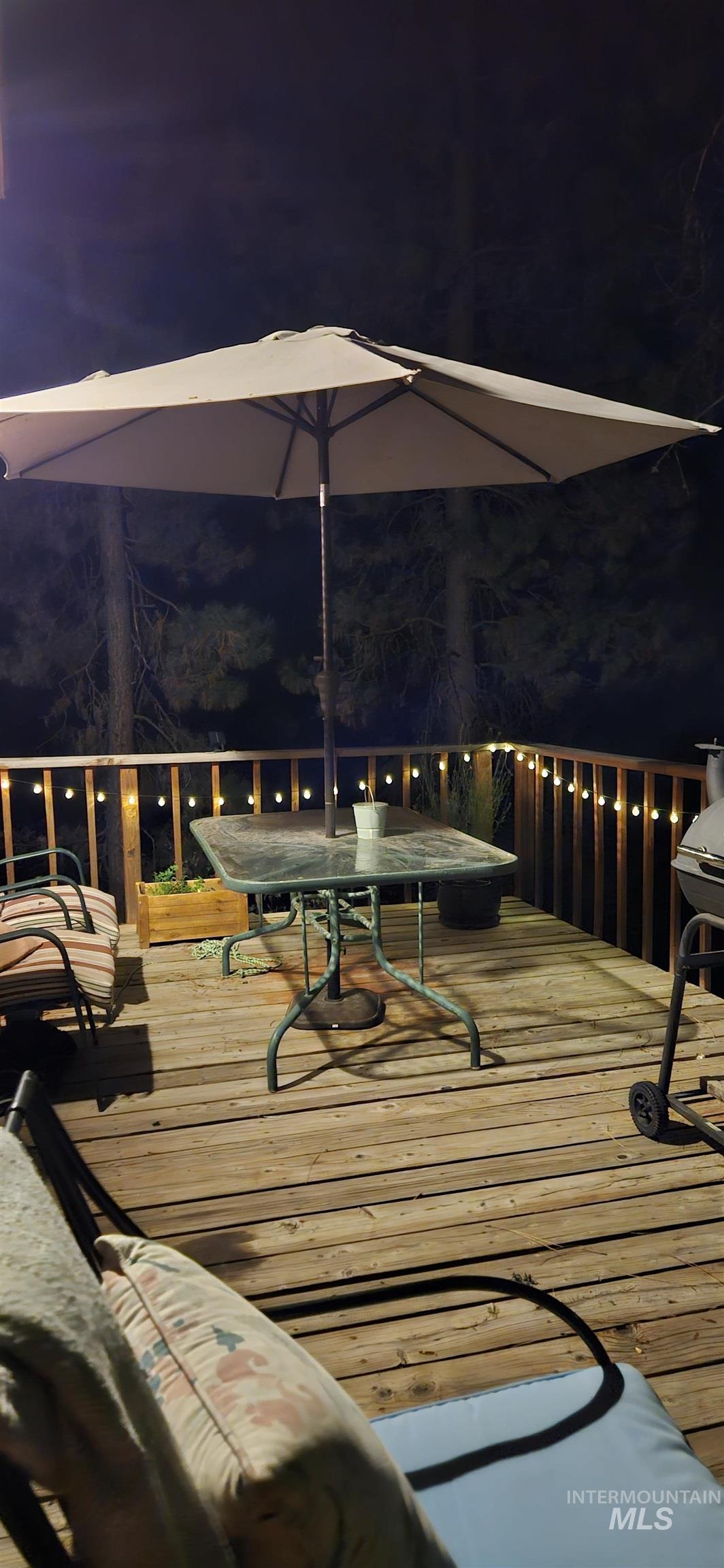 Deck at twilight featuring outdoor dining area