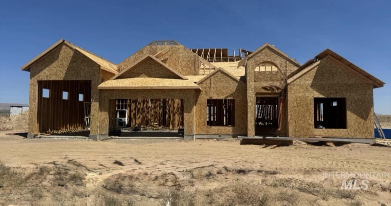 Property under construction with a patio area