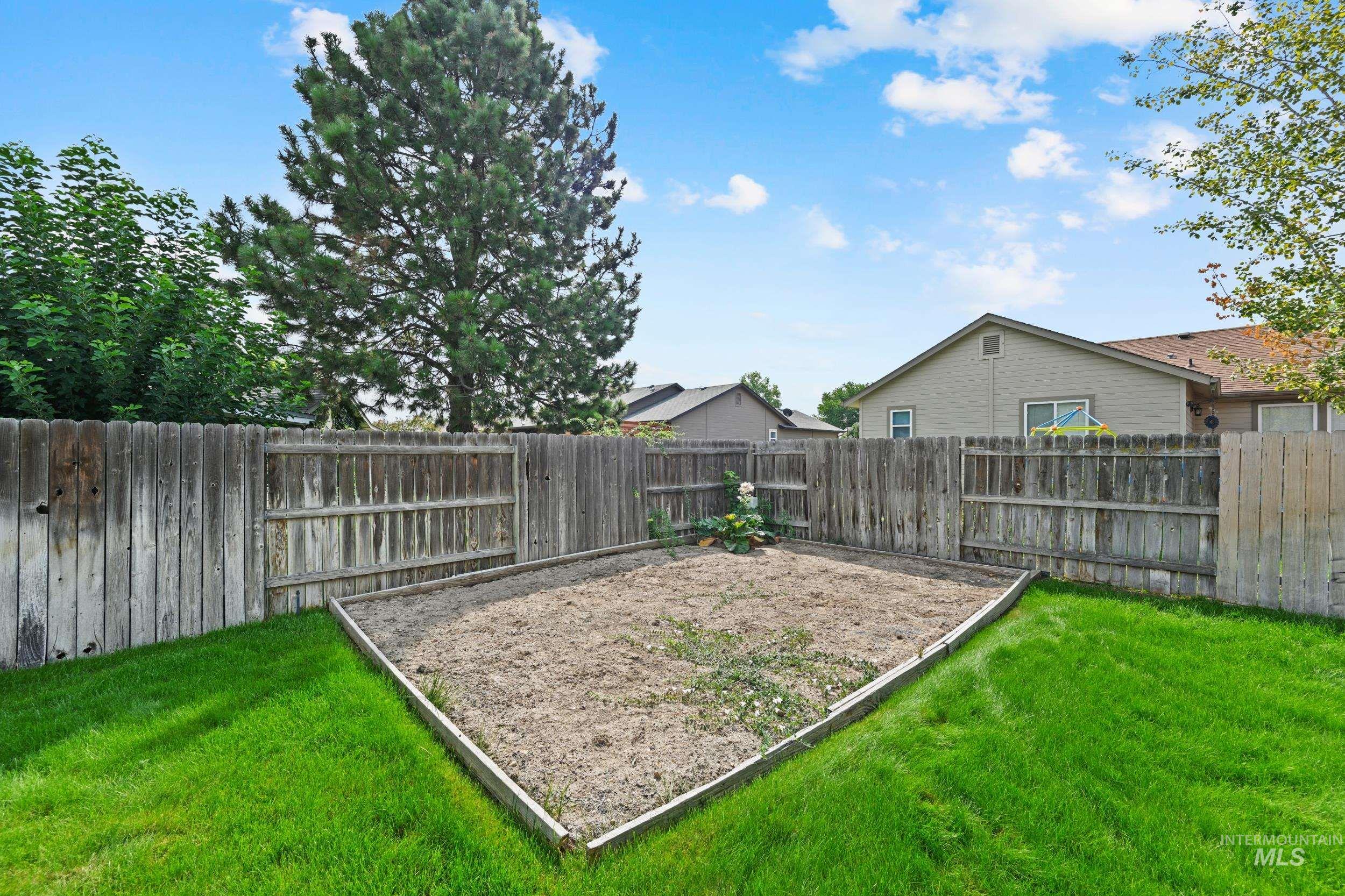 View of fenced backyard