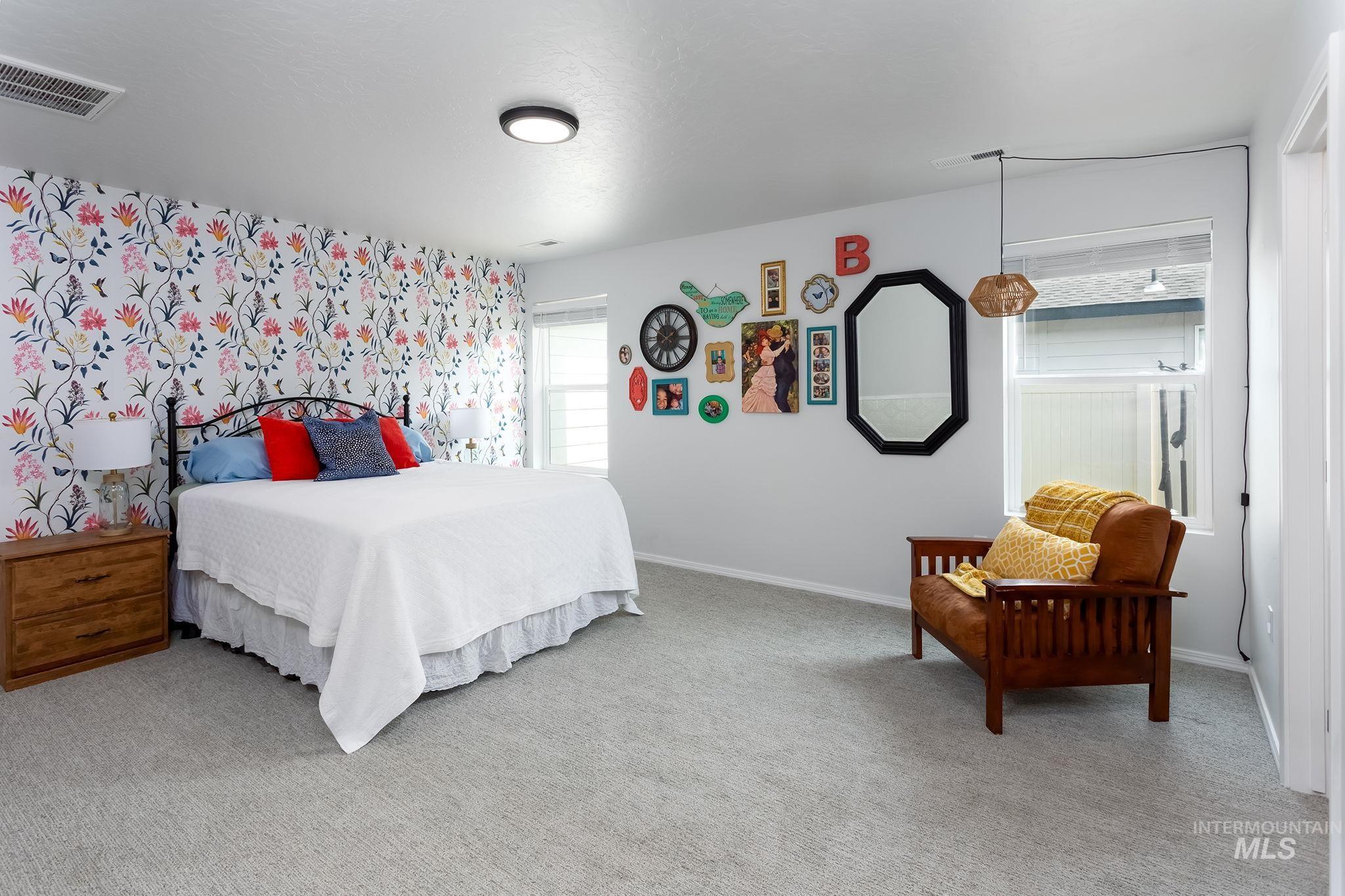 Carpeted bedroom with baseboards