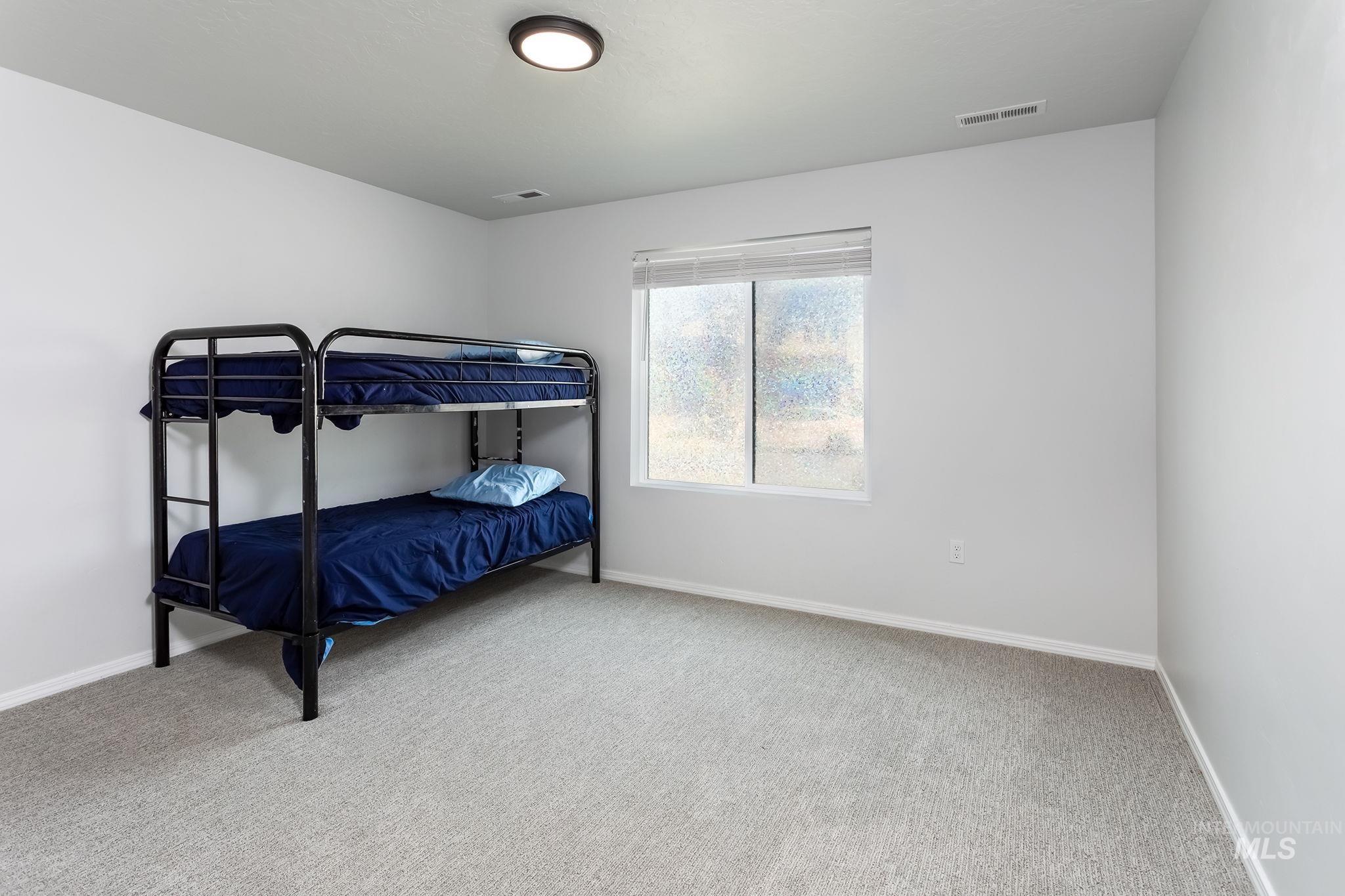 Bedroom featuring carpet flooring