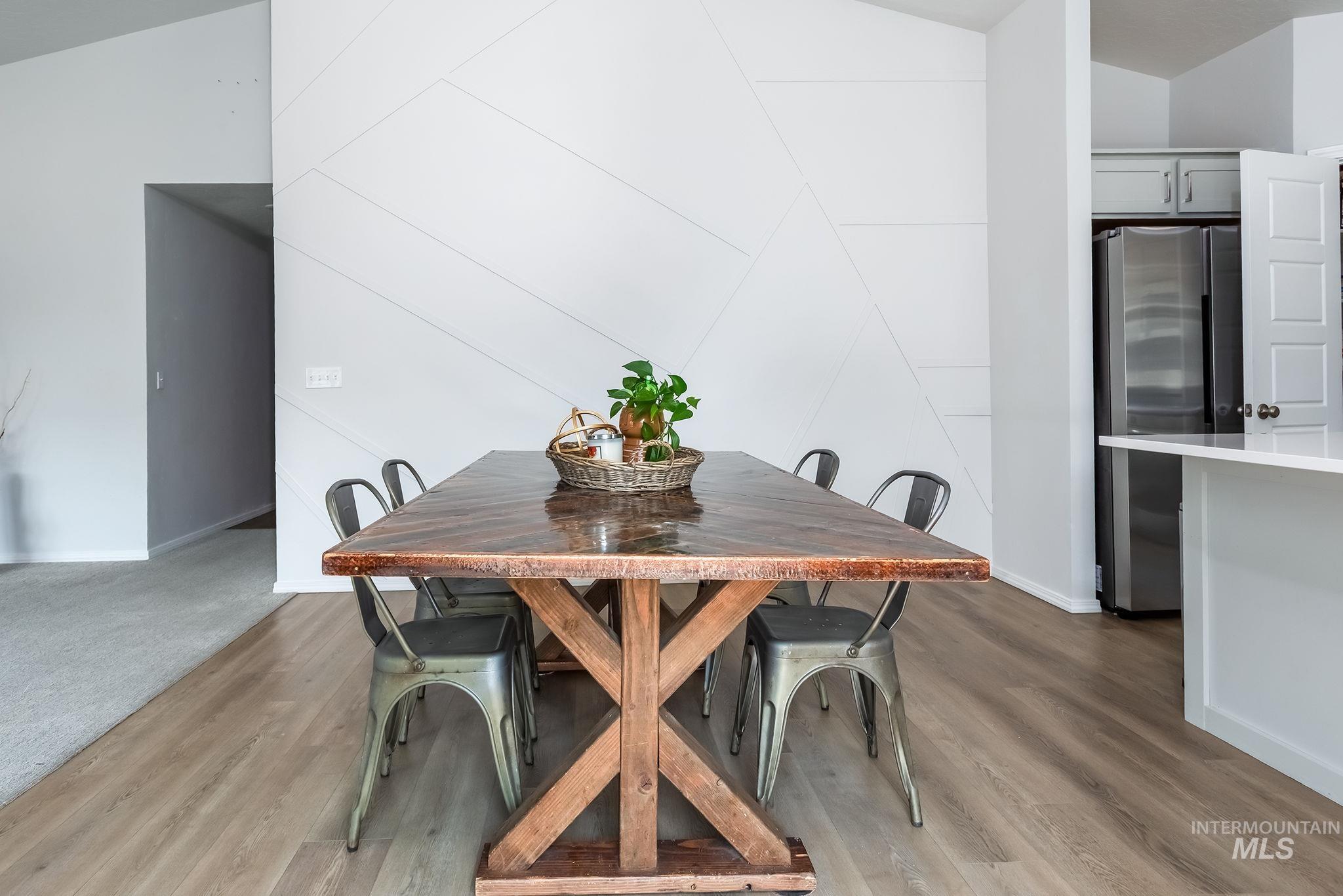 Dining area featuring light wood finished floors and baseboards