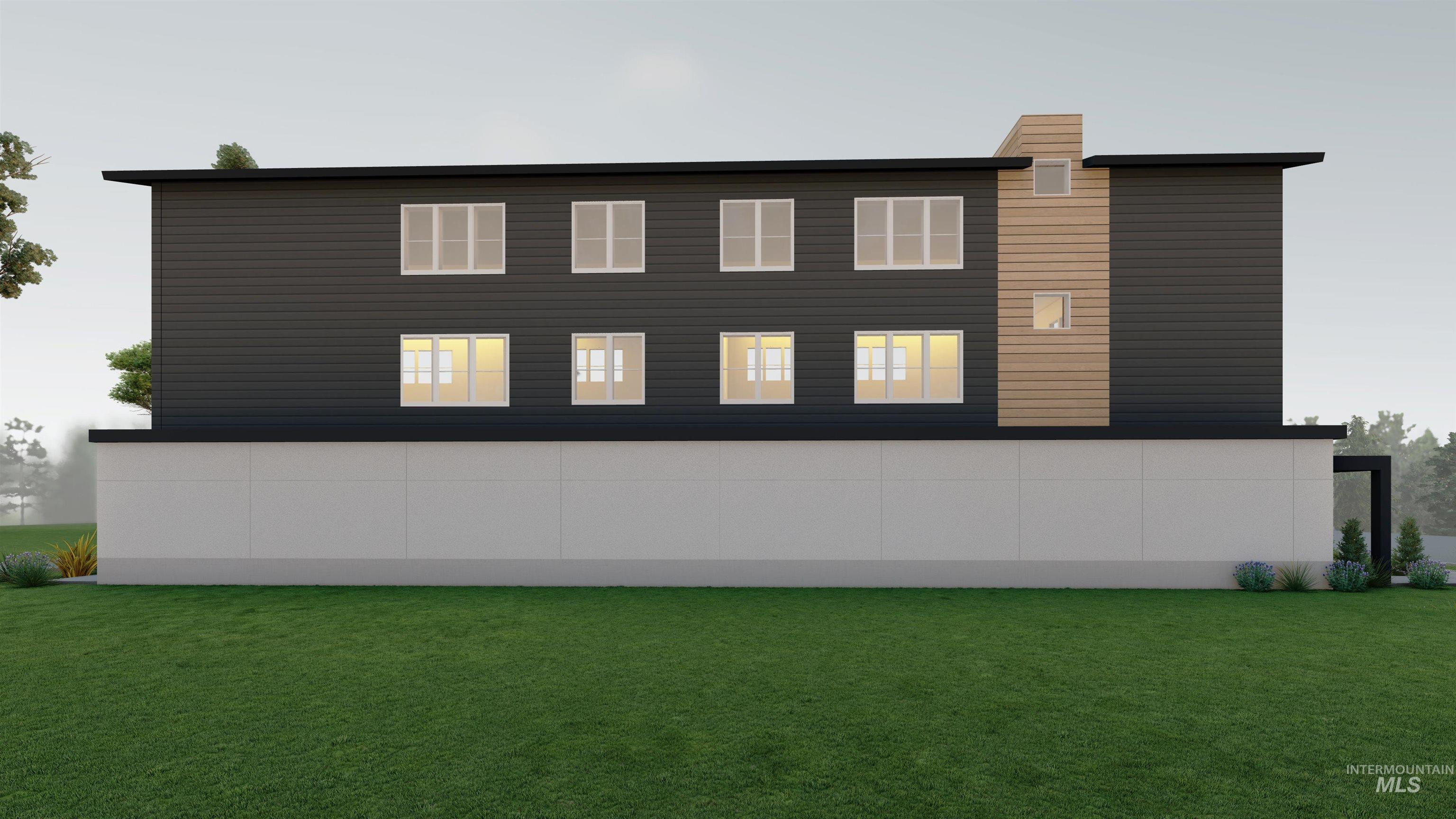 Rear view of house featuring a yard