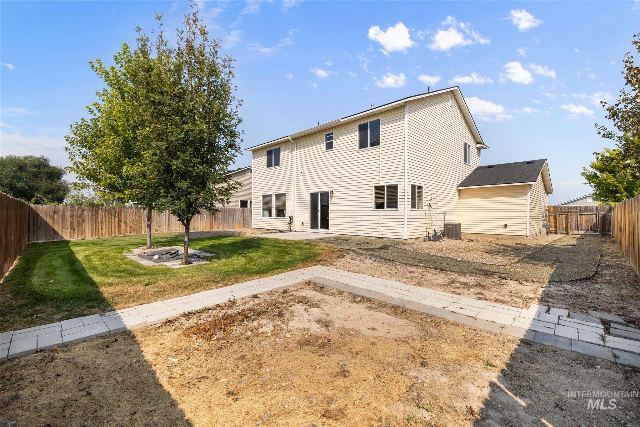 Back of property with a patio area and a fenced backyard